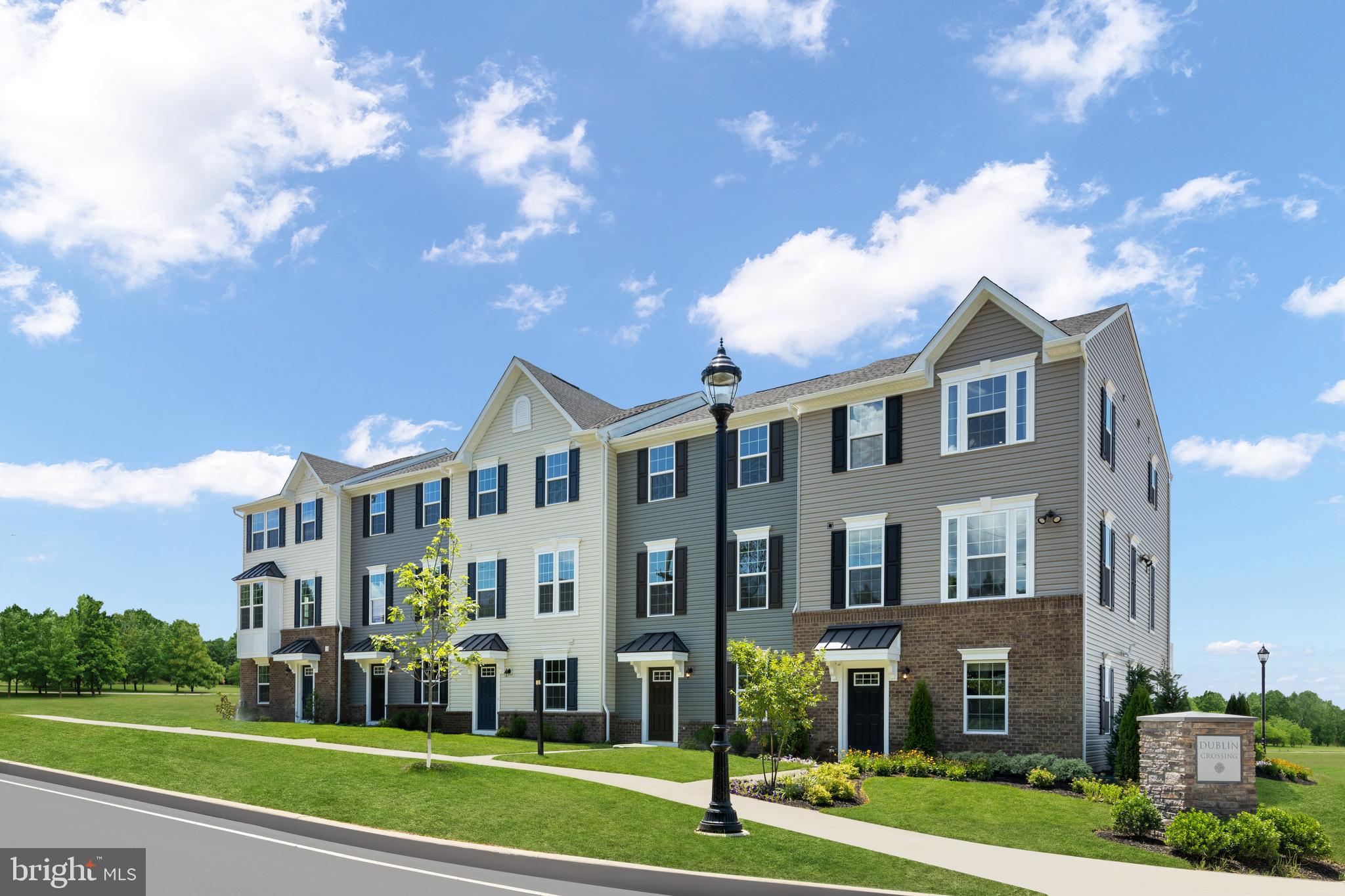 To be built In at Dublin Crossing. The only new townhomes with 1- and 2-car garages, in Dublin Town Center with shopping, dining and fitness, minutes to Doylestown. The largest of Ryan's Composer Series, the Strauss offers the space and customizing details of single-family living with the convenience of a townhome. On the main living level, you are greeted by an enormous Living Room featuring a large coat closet or a convenient powder room. Across an arched breakfast bar is a generous and airy Country Kitchen with island, perfect for entertaining. A window-lined Morning Room off the Kitchen provides room for dining and is accented with an optional hutch. Up a flight of stairs designed to be elegant and functional, the upper level boasts three bedrooms, two baths, and a 2nd floor laundry. No need to worry about storage space generous closets abound in all bedrooms. The Primary Bedroom is a private retreat featuring a tray ceiling and an enormous walk-in closet. A finished basement space is great for tools, bikes & more. Other floor plans and home sites available. Photos are representative.