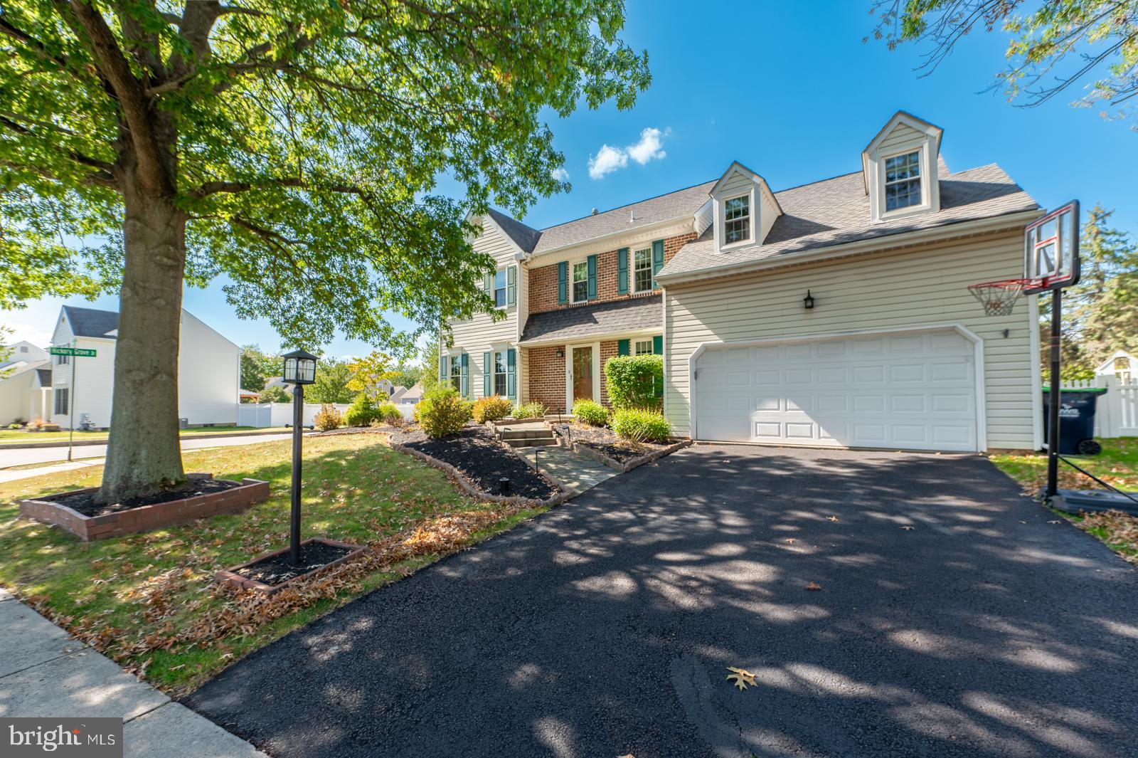 Welcome to 145 Bayberry Drive, a beautifully maintained home in the highly desirable Heather Glen community—just steps from Limerick Elementary and within the acclaimed Spring-Ford School District.
From the moment you arrive, the stately curb appeal and slate walkway set the tone for what’s inside. The attached two-car garage offers modern convenience with keyless entry, garage door opener, and pre-wired electric for an EV charging station. Step into a spacious foyer featuring upgraded luxury laminate flooring, a coat closet, and a well-placed powder room. The living room flows seamlessly into the dining area—perfect for hosting gatherings or quiet evenings at home. The kitchen is designed to inspire, with solid surface countertops, rich wood cabinetry updated with new hinges and hardware, and a newer stainless steel appliance package including a French door refrigerator, dishwasher, and smooth-top electric stove. A pantry adds generous storage, while the sunlit breakfast nook is sure to become a favorite spot. Just off the kitchen, the family room impresses with hardwood flooring, a cathedral ceiling with skylights, and wood beams. There is a wood fireplace complemented by stone that fills the room with warmth. The sliding glass doors open to a wood deck and PVC-fenced backyard—ideal for entertaining or relaxing in privacy. The laundry room and garage are conveniently located off the family room for easy access. Upstairs, double doors lead to a spacious primary suite with three closets, a ceiling fan, and a full bath featuring double sinks, a soaking tub, a shower stall, and a linen closet. Three additional bedrooms offer ample space, while the hall bath includes a tub/shower combo. The full basement offers excellent ceiling height and awaits your finishing touches. Additional highlights include a 200-amp electrical panel, natural gas hot air furnace, natural gas water heater, and a passive radon system. Located within sight of the school bus stop, this home also includes a one-year home warranty for added peace of mind.