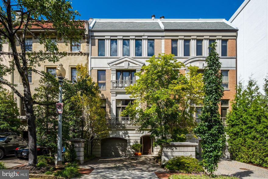 Incredible and striking 4-level townhome in historic Kalorama neighborhood w/ 4BR/4BA/2HBA. Entry level features and elegant foyer with elevator access (to all levels of home), access to attached 2-car garage, laundry rm & wine cellar. Main level boasts gleaming HWF, detailed moldings & fts. large 3-story Atrium w/  wrap-around staircase & expansive skylight 30ft above. 11ft+ ceilings throughout formal LR, DR & gourmet kit. Owner suite fts built-ins, ceiling fan, Juliet balcony, wood-burning FP, crown/base molding, luxury en-suite BA & walk-in closet. Family rm on top level fts ceiling fans, built-ins, wood-burning FP, wet bar, & powder room.  Landscaped private balcony and walkable to daily errands, fine dining & more!