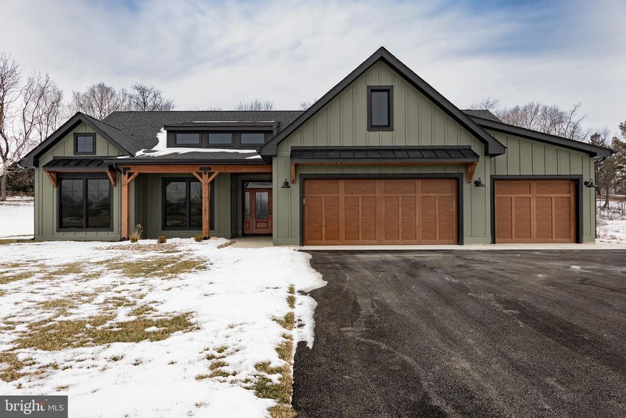 Completed and ready to move in! Introducing the first home built in the highly sought after community “The Reserve at Tuscarora.”  This high-end rancher was carefully designed to complement the lot it sits on and finished inside with upgraded features to ensure comfort and elegance.  Each feature of this stunning home has been hand selected by the builder and showcases unmatched craftsmanship and premium building materials throughout, setting a new standard for modern luxury.  
Inside you’ll find a gourmet kitchen with custom soft close cabinets and a custom matching range hood, an energy efficient appliance package, leathered granite countertops, a hidden WALK IN Pantry and a 9’ island with a stone veneer.  The living area has a stone fireplace which goes from the floor to the cathedral ceiling and is accented by a barn beam mantel finished in a rich linseed oil.  A 65" TV is already mounted above the fireplace for your enjoyment! In the Owner’s Suite, there is a full closet organization system in the walk-in closet.  The Owner’s bath has a fully HEATED ceramic tile floor, dual vanity, linen closet and a vast Wet Room area with a shower, stand-alone soaking tub and a LED illuminated niche. 
This beautiful home is protected by high level exterior features such as LP Smart Siding with a 50-year warranty, Ply-Gem MIRA windows, Haas Stained Garage Doors with Full Thermal Break and a Trane XR16 3.5 Ton Heat Pump with a 10 year warranty.    
The Greenbrier plan in The Reserve at Tuscarora redefines elegance with each detail meticulously chosen.  Don’t miss your opportunity to live in this brand-new community, where only a limited number of lots will be available.