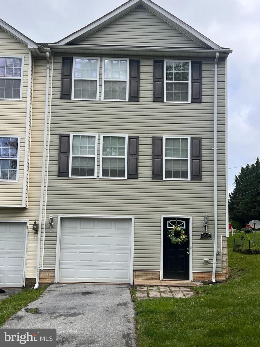 PRICE REDUCED!  Perfect for the first time home buyer or investor looking for a very low maintenance end unit town home. Off of a very quiet back street located in Charles Town. This house features a one car garage, large unfinished room in the basement, beautiful hard wood floors on the main level, kitchen nook or dining area, and roomy bedrooms. Own this home and have a mortgage payment less than rent!