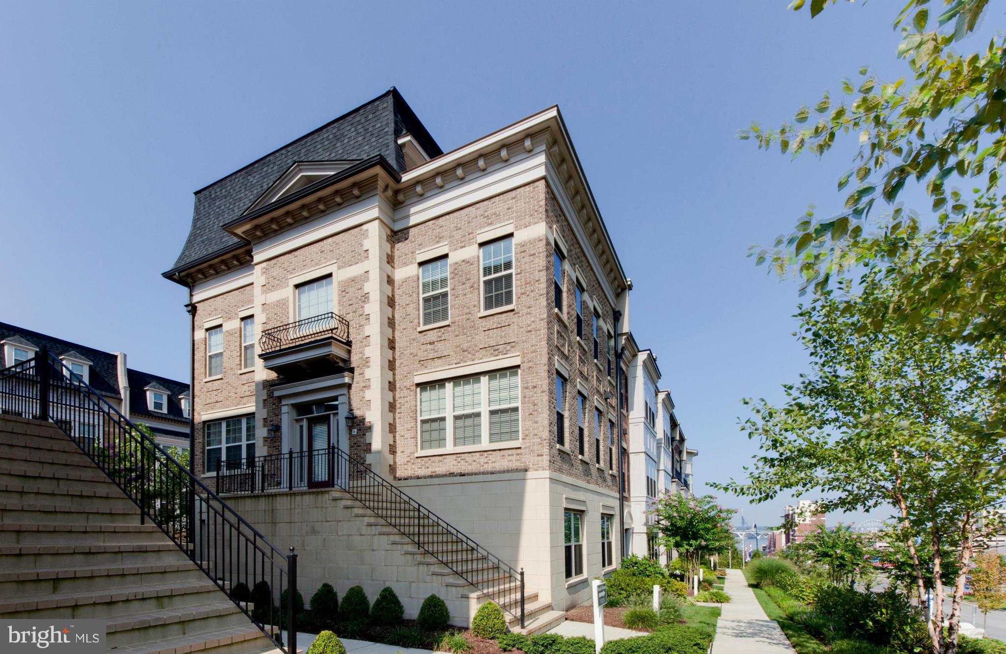 Exquisite End Unit Brownstone with Unique Design & 2 Car Garage. Home features inviting grand foyer. Large open floor plan with gas fireplace in oversized living room. Gourmet kitchen with gas cooktop & double oven. Stupendous water views of the Potomac River & DC from the large roof terrace featuring a double-sided gas fireplace. Only 2 blocks to public transportation & short drive to downtown DC