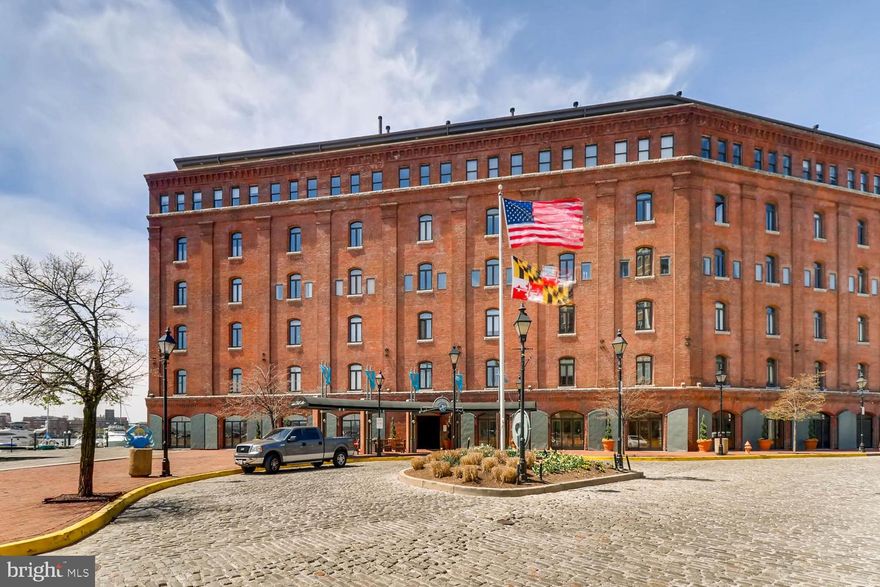 Discover the charm of 1000 Fell Street #215, a beautifully maintained one-bedroom condo located in the prestigious Henderson’s Wharf, one of Fells Point’s most coveted waterfront communities. Perfectly situated in the heart of Baltimore’s historic district, this residence offers a seamless blend of character, convenience, and style.
This open, single-level floor plan features large windows that overlook the serene English courtyard, flooding the space with natural light throughout the day. The living area is warm and welcoming, highlighted by hardwood floors, while the bedroom showcases an exposed brick accent wall, adding a touch of the building’s original charm.
The spacious bedroom includes a generous walk-in closet and provides access to the well-appointed bathroom, which is thoughtfully designed with dual entry from both the bedroom and the main living area. Whether you’re moving in full-time or looking for a turnkey second home, this condo is available fully furnished for ultimate convenience.
Enjoy the added perks of an in-unit washer and dryer, along with all the luxury amenities Henderson’s Wharf offers. Just steps away, you’ll find the best of Fells Point—top-rated restaurants, boutique shops, charming cobblestone streets, and picturesque harbor views.
Don’t miss this rare opportunity to own a move-in-ready waterfront home in one of Baltimore’s most desirable locations.