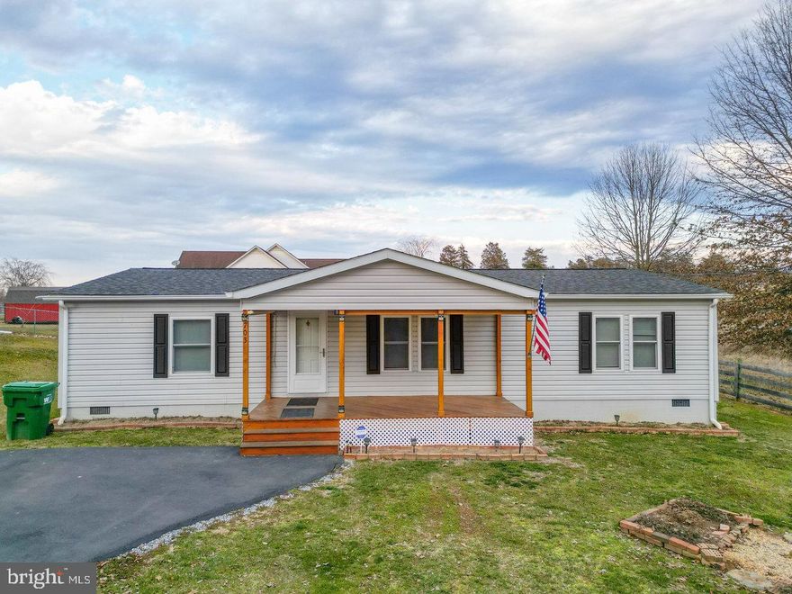 On the Corner of Town & Country! This 3 BR 2 BA manufactured home is in outstanding condition! Current owners have taken wonderful care of this property! The primary bedroom has a walk-in-closet and en suite large private bath. The home has an open floor plan with a large living room and kitchen/dining area. In 2016 the following upgrades were made: new roof, HVAC, flooring, siding kitchen cabinets and windows! Additionally, the Sellers added the covered front porch and rear 3 seasons porch. Very nice building/workshop with power! Enjoy commanding views of the Blue Ridge Mountains! The property is within walking distance of Ralph Dean Park, schools and shopping!