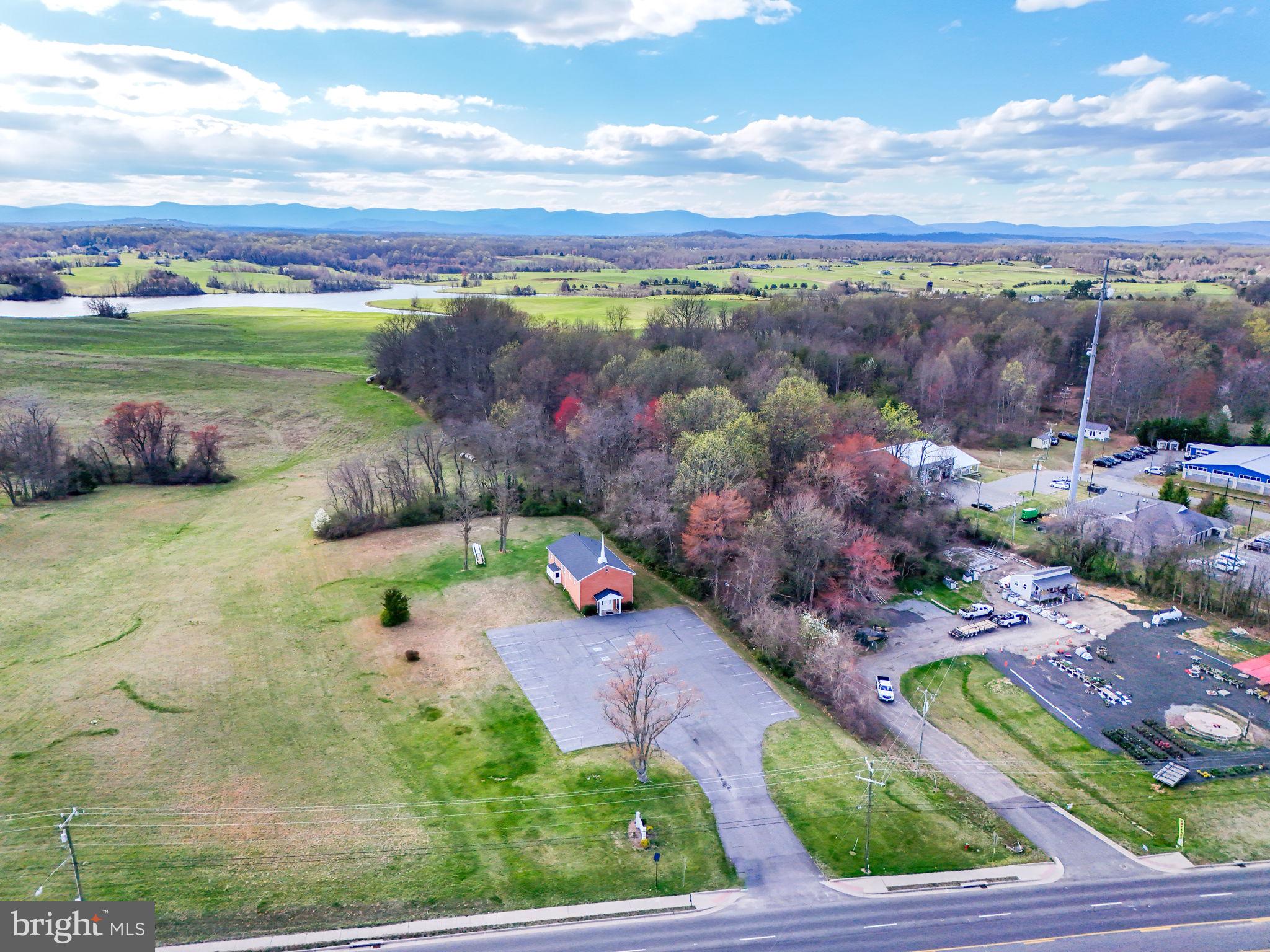 Once in a lifetime chance to be located on Main St in the Town of Culpeper. The building is at the very north edge of the town limits. This property 1.75 acres. This prime location offers immediate and direct access to shopping, schools, churches, homes & apartments. This location is zoned C3 and offered for sale by the original owners. Contact the listing agent for more information. Total of 3984 sqft on 2 levels, 1920 sqft each level. Main level- Stone entry foyer and reception area, bathroom, carpeted auditorium and training room. Upper level includes an office, multipurpose / kitchen room , 5 classroom and two bathrooms with multiple stalls and rear entrance/exit. approximately 50 paved parking spaces.