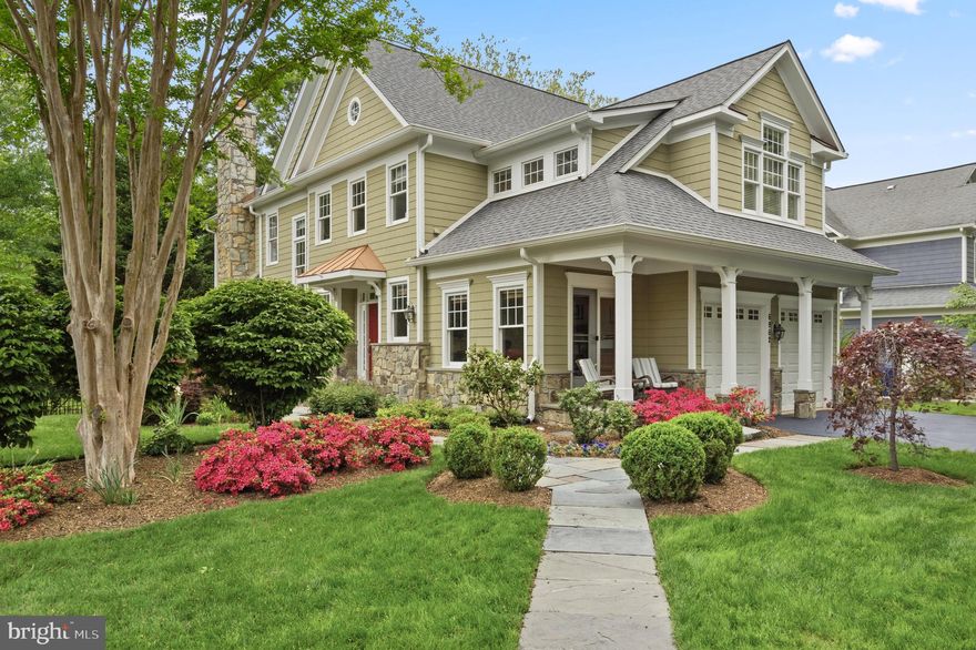 Ideally positioned on a premier corner lot, this custom Buchanan Price colonial blends exquisite craftsmanship with modern luxury in the heart of West McLean. Sited on a generous quarter-acre backing to a tranquil wooded stream, the south-facing property is surrounded by curated gardens, charming cherry blossom trees, inviting outdoor spaces ideal for relaxing or entertaining, and a fully fenced backyard with direct access to a neighborhood walking path. 

Inside, over 4,500 square feet of sun-filled living space is defined by hardwood floors, nine-foot ceilings, and refined millwork. The main level centers on a gourmet eat-in kitchen equipped with Sub-Zero and Miele appliances, granite countertops, and an island—opening seamlessly to a family room anchored by a striking stone fireplace. From here, step onto the elevated deck to survey the serene backyard oasis below, featuring stone walking paths and lush privacy plantings. Formal living and dining rooms, a private study, and a grand foyer with a curved staircase and modern chandelier complete the main floor.

Upstairs, the spacious primary suite features a 10-foot tray ceiling, a large walk-in closet, and a luxurious en-suite bath with double vanity, soaking tub, and walk-in shower. Three additional bedrooms, two full baths, and a convenient laundry room complete this floor. The fully finished walk-out lower level provides versatile space for guests or extended living, offering a large recreation room with a second stone fireplace, a game room, a fifth bedroom suite with dual-access bath, and a substantial storage room. This home’s enduring quality is reinforced by significant infrastructure upgrades, including a new CertainTeed Landmark roof (2023) and dual Carrier HVAC systems (2022 & 2018).