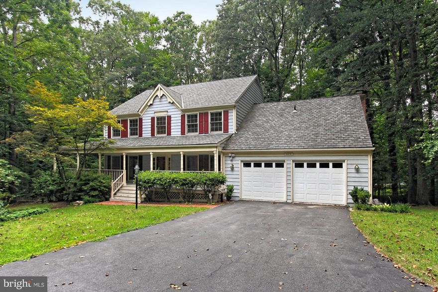 Elegant Colonial home w/5 BR & distinctive wraparound porch*Private/peaceful/idyllic.84 acre setting surrounded by trees*Pvt den on ML w/adj full bath*Refinished hardwoods in LR/DR/entry*Remodeled gourmet kit w/bkfst area/bay window*Great FR off kit w/cath ceilings*Big MBR suite w/lux remodeled pvt bath*Daylight LL w/5th BR/4th full bath/2nd kitchen area*Large deck*Sprinkler system*