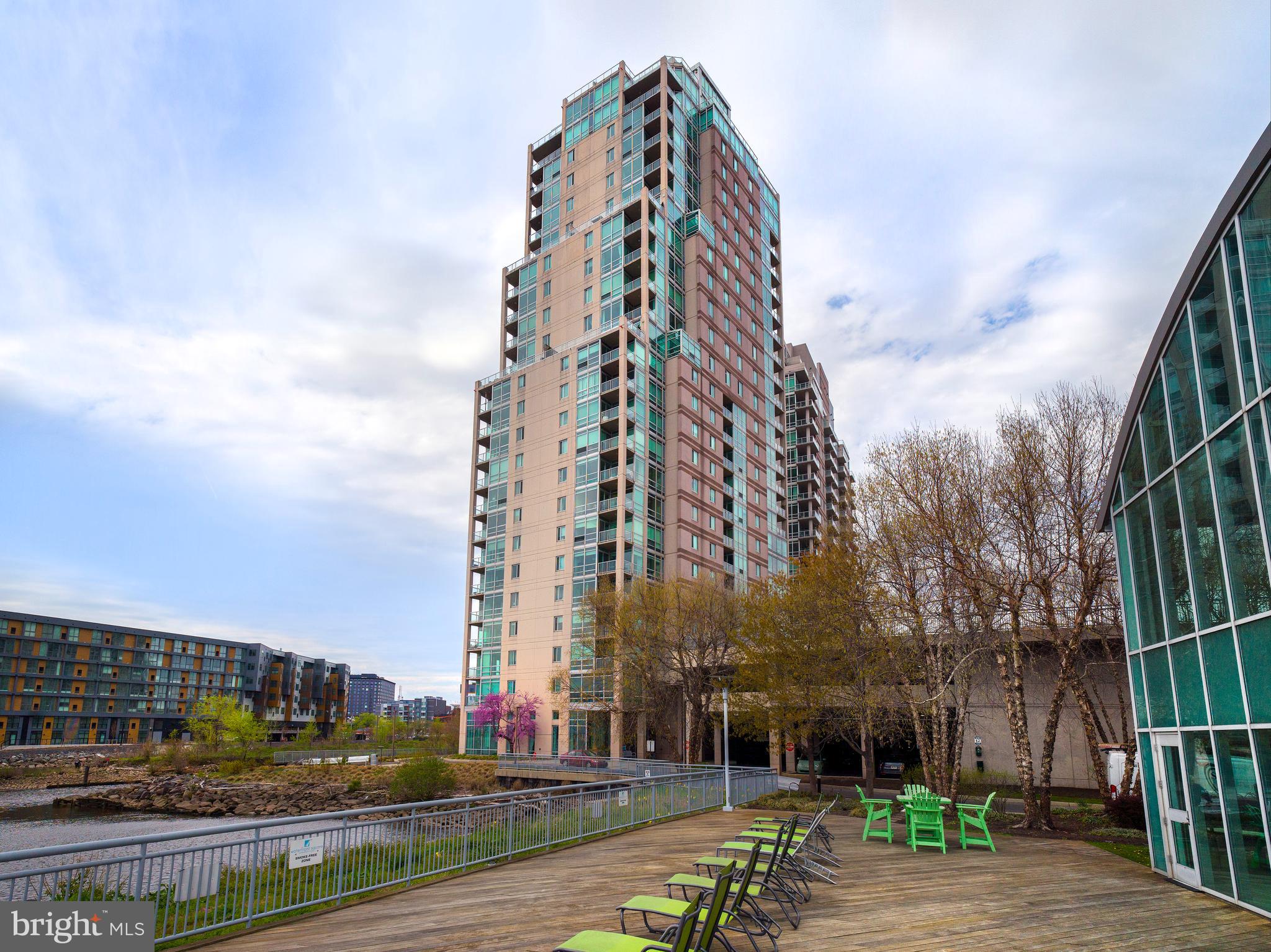Welcome to Unit P506 at Waterfront Square in Northern Liberties! This stunning residence showcases panoramic, unobstructed views of the Delaware River, Ben Franklin Bridge, and Center City skyline through oversized floor-to-ceiling windows. The floorplan is perfectly open, allowing you to admire the views the moment you step into the unit—whether you're cooking in the kitchen or relaxing in the living room.
The oversized bathroom features 12-inch marble tiles throughout, a deep-soaking tub and a large vanity. There is a conveniently located laundry area tucked behind closet doors, complete with additional shelving.
The spacious primary bedroom easily accommodates a king-size bed with side tables and still offers enough room for a home office. It boasts both a walk-in closet and a reach-in closet, both outfitted with added shelving for ample storage. There are also additional closets in the entryway and hallway.
1 parking license is included!
Waterfront Square Condominium & Spa is a premier gated community offering 24/7 guard and gate services, concierge, valet parking, an indoor pool and hot tub with river deck, state-of-the-art fitness center, sauna and steam room, massage rooms, and community spaces. The three-level garage is topped with Philadelphia’s largest green roof.
Situated on a 9.5-acre riverfront enclave with beautifully manicured outdoor parks and gardens, Waterfront Square offers an on-site management team and an advanced security system with closed-circuit TV. For your convenience, Global Limousine runs on-site Monday through Friday, taking residents as far as 30th Street Station and back.
The oversized river deck features a 25-meter heated lap pool (junior Olympic size), and EV stations are available for electric vehicles.
Waterfront Square boasts an ideal location—close to major highways and airports (676, I-95, all bridges), yet tucked away along the serene Delaware River. If it’s unparalleled luxury and the best views in Philadelphia, adorned with resort-style amenities, then it must be Waterfront Square Condominium & Spa!