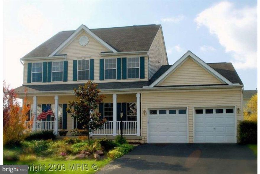 Relax on the front porch or sun on the back deck of this 5 bedroom spacious home.   Two story family room with fireplace.  Gourmet kitchen, hardwood floors, finished basement with bar. Master bedroom with soak tub/sep shower. Living  office, sep. dining room, Partially fenced. Large driveway and two car garage.  1 pet ok with $25.00 a month pet rent and deposit.  Ready to move in!