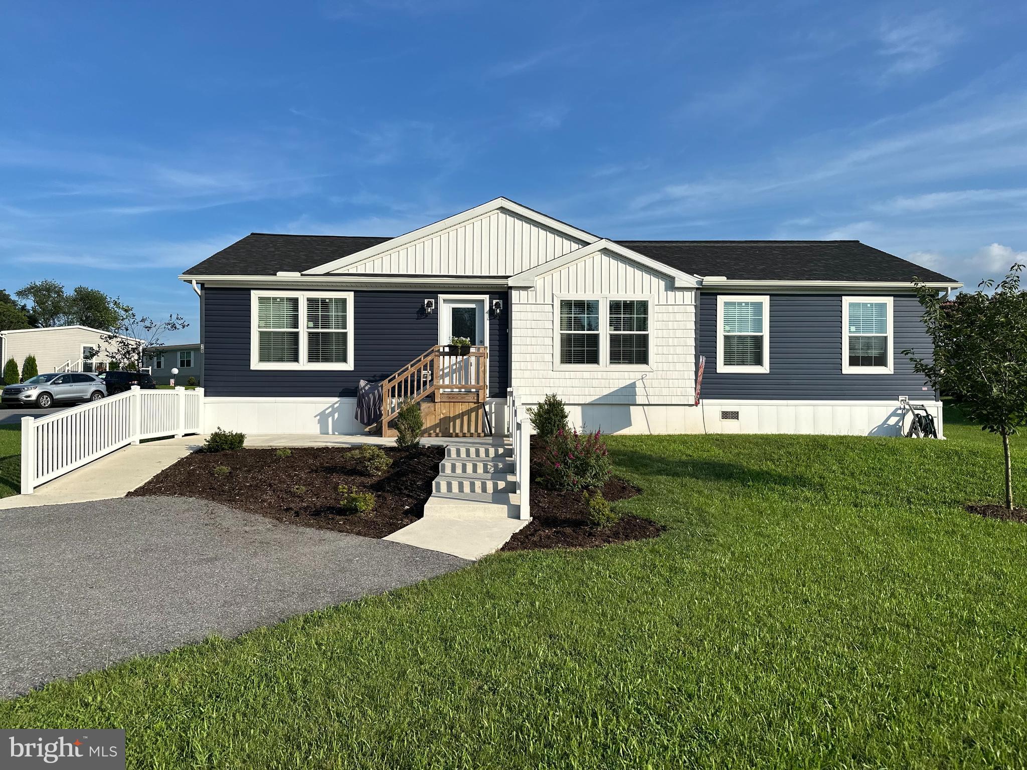 Welcome to this modern like new home in Oak Ridge Estates. Just 2 years old, this home is priced well under new, like kind models. It features a spacious modern kitchen with a gas range. All appliances remain. Open concept living area. The primary bedroom with en suite is a must see. Definitely a major highlight of this home; featuring an oversized dream-shower with rain head and detachable shower head. The extensive double vanity provides tons of counter space and storage. There are 2 more bedrooms and a full bath. This home is on a spacious lot with very nice landscaping, a storage shed, and off street parking for 2 cars/trucks. This is a must see! Chair lift can be purchased separately. If Buyer isn't interested, Seller will remove prior to settlement.