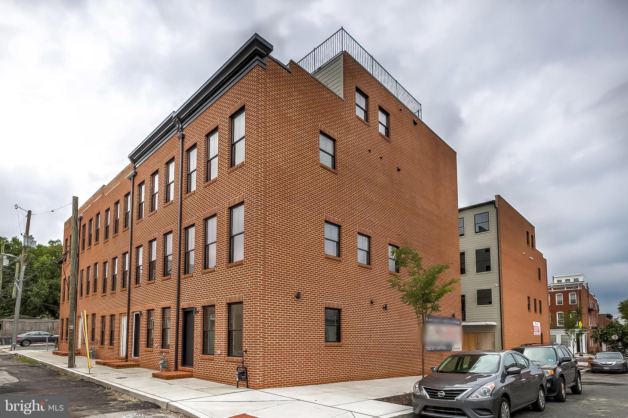 MODEL HOME IS NOW OPEN! NOW SELLING - FEDERAL HILL'S NEWEST 10 UNIT COMMUNITY - HANOVER CROSSING! ONLY 1 OF 2 END UNITS AVAILABLE. THIS OLIVE ST END UNIT IS ABSOLUTELY STUNNING. 16+ FT WIDE BRAND NEW CONSTRUCTION CUSTOM HOMES WITH OVERSIZED GARAGE PARKING LOCATED IN THE HEART OF FEDERAL HILL. GLISTENING FINISHED IN PLACE HARDWOODS CASCADE THROUGHOUT. ENJOY CUSTOM SOFT CLOSE CABINETRY, UPGRADED TRIM AND PAINT PACKAGE, IMPORTED TILE, DESIGNER LIGHTING, GRANITE/QUARTZ COUNTERTOPS, SS APPLIANCES IN DESIGNER CHEF'S KITCHEN WITH GE MONOGRAM APPLIANCE PACKAGE. LOADS OF NATURAL LIGHT. 4 FINISHED LEVELS. 2,700+ SQ FT. HIGH CEILINGS. WALK-IN SHOWERS. WALK-IN CLOSETS. 4 OVERSIZED BEDROOMS WITH 4 FULL BATHROOMS. GORGEOUS BATHROOMS INCLUDE FRAMELESS GLASS SHOWERS AND RAINFALL SHOWER HEADS. EXPANSIVE ROOF DECK FOR ENTERTAINING WITH STUNNING VIEWS WITH WETBAR ON 4TH LEVEL. ENJOY SECONDARY OUTDOOR BALCONY OFF KITCHEN. 5 YEAR NEW CONSTRUCTION/HIGH-PERFORMANCE TAX CREDIT AVAILABLE, SUBJECT TO DHCD APPROVAL. BUYER TO TAX ALL TRANSFER TAXES. CLOSE PROXIMITY TO RETAIL SHOPPING, LOCAL DINING, AND ALL MAJOR HIGHWAYS. SCHEDULE A PRIVATE TOUR TODAY!