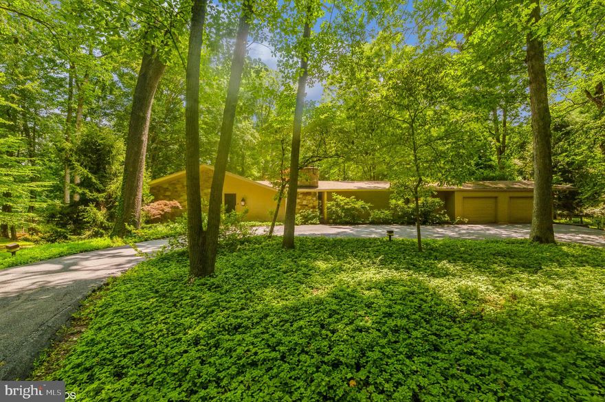 MOVE RIGHT INTO THIS FABULOUS, IMMACULATELY MAINTAINED HOME SITUATED ON A GORGEOUS PRIVATE 2.7 ACRE LOT. SPACIOUS LIVING ROOM & DINING ROOM WITH STONE FIREPLACE, BEAUTIFUL INLAID HARDWOOD FLOORS & FRENCH DOORS LEADING OUT TO THE PATIO. LARGE CHEF’S KITCHEN WITH GRANITE COUNTERS, FULL SIZE SUB-ZERO REFRIGERATOR AND FREEZER, LARGE PANTRY & BREAKFAST AREA. MAIN LEVEL DEN OFF OF THE FOYER FEATURES A FIREPLACE AND A MASSIVE WALL OF GLASS THAT ALLOWS YOU TO ENJOY THE GORGEOUS WOODED LOT ALL YEAR LONG. THE PRIMARY BEDROOM SUITE HAS BUILT-INS, WALK-IN CLOSET, RENOVATED BATH & FRENCH DOORS TO THE BALCONY. THERE IS A SEPARATE ROOM DESIGNED AS A CUSTOM WALK-IN CLOSET WITH BUILT-INS, SKYLIGHT & DOORS TO THE BALCONY WHICH CAN EASILY BE CONVERTED BACK TO A BEDROOM. 2 ADDITIONAL GENEROUS SIZED BEDROOMS & HALL BATH. THE LOWER LEVEL HAS A HUGE FAMILY ROOM WITH WET BAR, POWDER ROOM, DELUXE LAUNDRY ROOM AND PLENTY OF STORAGE SPACE. REAR BRICK HERRINGBONE PATIO THAT OVERLOOKS THE POOL AND METICULOUS LANDSCAPING IS PERFECT FOR ENTERTAINING OR JUST SITTING AND RELAXING. IN-GROUND POOL ("as is" hasn't been used for at least 10 yrs). 2-CAR GARAGE. DON'T MISS OUT ON THIS GREAT HOME IN THE DESIRABLE VELVET VALLEY NEIGHBORHOOD!