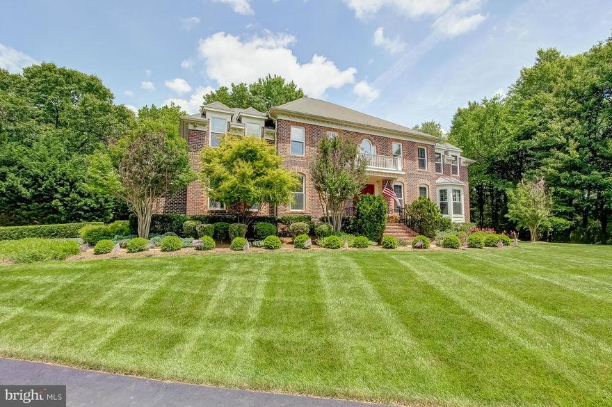 Success is defined by this beautiful and well-appointed, all brick home.  Offering, generous rooms sizes throughout, gorgeous moldings, stunning chandeliers.  Outstanding Kitchen/Family Rm. Combo.  Enjoy, media, billiard, exercise rooms and bar.  Luxurious Master Suite. Plush Landscaping, Sharpen your golf skills with your own, putting, chipping & sand trap.  Easy access to Reston, Tyson"s, Dulles