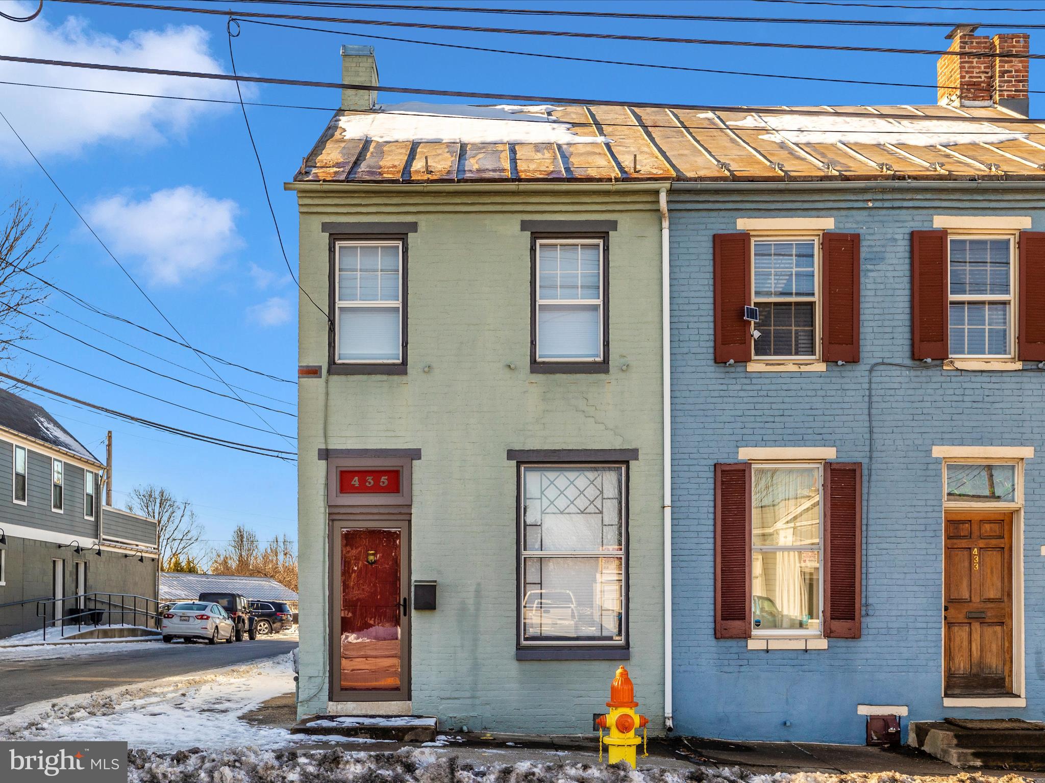 PRICE IMPROVEMENT! This home is also available for a year lease...
435 S Market St in Frederick, MD, is a historic end-unit townhouse built in 1875, offering a blend of classic charm and modern updates. The property features 3 bedrooms and 2.5 bathrooms across approximately 1,772 square feet of living space. The main house is equipped with a ductless mini-split system for heating and cooling, supplemented by a centrally located woodstove in the dining room. The third-level studio/den provides a private retreat, while the landscaped gardens and covered rear porch create a serene outdoor oasis. Located in the Frederick Historic District, this home offers easy access to downtown amenities and includes four off-street parking spaces.