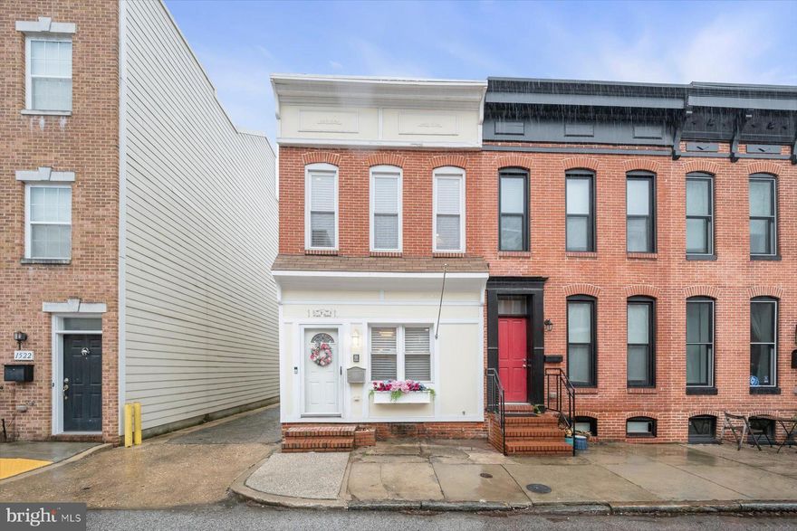 Welcome to 1540 Marshall Street, an exquisite end-unit rowhome in the heart of Federal Hill in Baltimore. This remarkable residence showcases gorgeous hardwood floors, exposed brick walls, tray ceilings, and classic moldings that flow throughout the home, blending timeless character with modern comfort. The inviting living and dining rooms transition seamlessly into the beautifully appointed kitchen, featuring ample cabinetry, granite countertops, stainless steel appliances, recessed lighting, and elegant medallion ceiling molding, creating a space that is both functional and refined. A convenient powder room and access to the rear parking pad complete the main level.
Upstairs, the primary bedroom serves as a serene retreat highlighted by a dramatic double tray ceiling, exposed brick walls, crown molding, and a track door leading to the renovated en-suite full bath. A second bedroom, also featuring exposed brick walls, is accompanied by a full bath and access to a wide staircase that leads to the rooftop deck, offering beautiful city views. The fully finished lower level provides additional living space with plush carpeting and a spacious double-door closet, making it ideal for a recreation room, guest space, or home office.
Step outside to the rooftop deck and entertain family and friends while enjoying sweeping city views. Ideally located with convenient access to major commuter routes including Interstate 95, Interstate 695, and Interstate 395, this home is truly a must-see.
