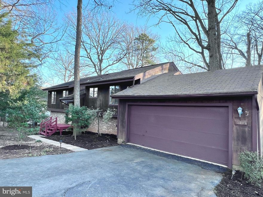 LOCATION, LOCATION, LOCATION !  Welcome home to a truly special SERENE setting *Rare opportunity to purchase a home with a HUGE private lot (nearly 3/4 of an acre) with natural beauty that is hard to find *SPACIOUS, light filled 4BR + 3BA on a fantastic peaceful setting *Well maintained and move-in ready, but plenty of room to expand if desired and add your personal touches *Free-flowing, contemporary floor plan *Large living area w/wood burning fireplace, dramatic vaulted ceilings, and walk out to deck overlooking beautiful rear yard *Separate dining room w/high ceilings is adjacent to the large, Eat-in kitchen with loads of cabinet space, upgraded granite counters,  stainless appliances, interior access to garage + wood floors *The top level has a primary bedroom that is en suite w/natural light, walk-out to deck/balcony, dressing area + FULL BATH *There are also 2 more bedrooms and a full bath on this level *The fully finished lower level features a huge family room with a walk-out to the PRIVATE REAR YARD that is expansive with a patio and plenty of mature trees & garden areas *The lower level also has a kitchenette which is perfect for guests, an Au Pair, or easy access for snacks  *There is also a bonus 4th bedroom; a full bath; full laundry/mechanical room; den/office area that can be converted to a 5th BR; and nice storage *2-car GARAGE + circular driveway *Completely freshly painted, new carpeting, lighting upgrades + more *Sought after Fairfax schools *Easy access to major road arteries (495/50/66), makes this attractive to commuters to DC, Pentagon, Amazon HQ2 and western FFX Cty to name a few *Super convenient near the Mosaic District, Only 1 mile to Dunn Loring Metro, near Tyson's, Fairview Park, Inova FFX hospital, a myriad of fabulous restaurants, shops, movies,  entertainment, bike trails, local parks, hot spots, etc. *Copy of county plat in document tab*