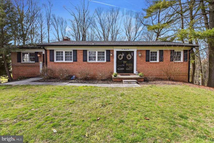 **Contract deadline 8pm on Friday 3/31/2023**
. This is NOT your average Timonium rancher.  There is so much more than meets the eye with this unique home that is nestled in the most divine setting.  If entertaining is your jam, this home is your preserves.  The main level has a wonderful open floorplan that includes a large living and dining room anchored by expansive windows and the most amazing fireplace.  A cooks kitchen boasts extensive cabinetry, stainless steel appliances, a wonderful peninsula and treasured finds like an indoor brick grill and a serving window to the deck.  The main level deck is beyond words.  Perched as if you are sitting at the top of the trees!  The setting, the layout and the space make it ideal to gather and enjoy good company.  The main level primary suite offers peaceful rest after your friends and family decide to leave (although they will want to stay!).  Don’t fret after you close the deck for the Winter season.  The lower level is a sophisticated and elevated recreation center!  A great room is warmed by a gas stove and a bar/kitchen area that evokes the feelings and comfort of Cheers.    The lower family room is perfect for games of all kinds or snuggling down for a movie marathon.  Three more bedrooms, two full bathrooms and the bonus room that can be outfitted with any imagination.  The outside lower deck and hot tub overlook the rolling one-acre of a forest-like setting.   101 Tree Top Court is an hidden gem.  You will not be disappointed!