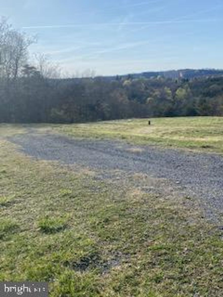 6.29 -acre lot available in the exclusive neighbor Breezy Ridge Estates off of Pious Ridge Road.  ELECTRIC, WELL and SEPTIC in place as there was previously a house there that burned down.  
Some cleared land, mostly wooded with views.  The Restrictions will be recorded at settlement.  Great location, easy commute to Rt 70, and close to Berkeley Springs for shopping, restaurants and concerts in the park during the summer.