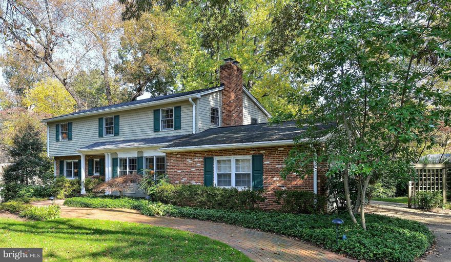 Beautiful CASE Design/Build remodel of this one-of-a-kind southern colonial steps from the GW Parkway in sought after Bridgehaven. Huge chefs kitchen has access to 1/2 acre professionally landscape/lit yard. Charming family room has built-ins & wood burning fireplace. Large bedrooms (master has walk-in/sitting space. Finished basement with walk out full bath and workshop. 2 car-garage too.