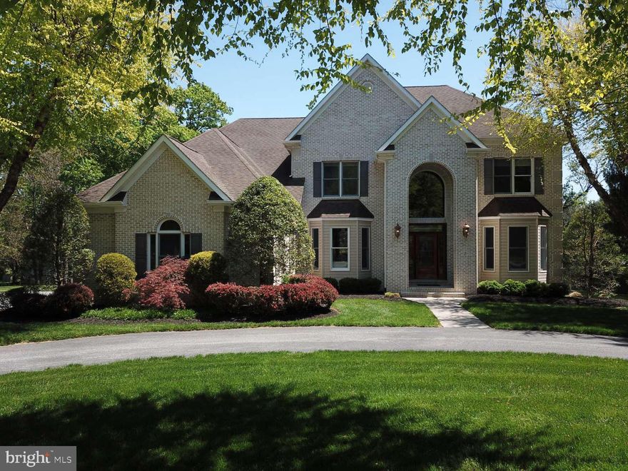 Welcome to your 4 BR/ 5.5 Bath OPEN floor plan home in the perfect Falls Road corridor location. Custom built 4,562 sqft w/ 9 ft. ceilings throughout boasts a large eat-in kitchen integrated with a sunroom with 2 skylights that leads into a spacious Family room with no walls making the ultimate place to entertain family and friends. The Family room has a large wood burning fireplace and a built in Dolby 5.0 surround sound system. The Kitchen provides plenty of cabinetry for dishware, glassware, and cooking ware. There are 2 separate ovens perfect for entertaining. A center island and maintenance free Silestone countertops complete this area. The large 1st floor Office/Bedroom can be cordoned off from the rest of the house by a pocket door making the full bath adjacent a possible 5th bedroom en-suite. 1st floor Laundry room with 7ft countertop and utility sink, cabinetry and laundry chute from the master bedroom. There is also a toilet in the laundry room so that muddy little ones playing outside can come into the house keeping the dirt to a minimum. The Entrance Foyer has soaring 20 ft. ceilings with a large atrium window allowing an abundance of natural light. The Living Room and Dining rooms are both off the entrance foyer. The LR could double as an office and the DR is large and opens to the family room. The second floor Primary Bedroom is large and has a double-sided propane fireplace separating the sitting area from the sleeping area. The master bath has his and hers vanities and sinks separated by a soaking tub. There is also a large shower and the toilet is secluded in its own room with a pocket door for privacy. The rear hallway leads to the separate his and hers walk-in closets which are large enough to store all of your clothes. At the end of the hallway, there is a substantial bonus room over the garage that can be used for luggage storage, a personal gym, or an extension of closet space. The 2nd Bedroom is en-suite, has a walk-in closet and separate closet with shelving. Bedrooms 3 and 4 also have walk-in closets and share a Jack & Jill bathroom. Each have their own vanity and sink separated by a pocket door and the toilet and tub/shower combo is on the BR 4 side. Fully finished basement with 9 foot ceilings, wet bar, built-in cabinetry with granite countertops, space framed for a mini fridge and plumbed for an icemaker. There is a full bath, pool table/ping pong table area, built-in glass memorabilia case and oversized walkout. There is a Theater/Gaming room with an HD projector and 100” screen with 3 leather recliners and Dolby 5.0 surround sound. The 700 sqft storage room has built-in shelving throughout with 2, 80 gallon water heaters and a propane furnace that services the basement and first floor. There is a BRAND NEW (5/2026) attic electric heat pump that services the 2nd floor. The back patio is fully bricked with a paver deck measuring 1,000 sqft has a built-in propane BBQ and burner that runs off the house propane with a granite countertop. Integrated lighting in the steps and walls set the mood for the mounted speakers that are also hooked into the FR system with separate volume control. There is also a wood burning fireplace and spa making this area perfect for entertaining and relaxing. There is a stand alone playhouse/shed that has a garage door that can be used for all kinds of different uses. It has electric and a loft for storage. The 3 car garage measuring 700 sqft. also with built-in shelving and a hot/cold hose bib. Circular driveway in front with large paved area on the side of the house in front of the garage with ample parking and a basketball net across from the firewood storage lean- to. Also included is a Generac whole house generator that runs off of the 2,000 gallon owned propane tank.