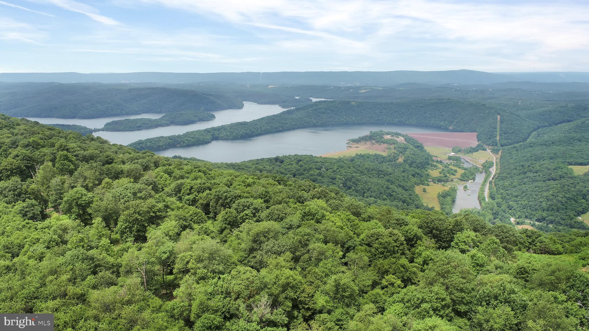 A beautiful and unique property! It's perfect for someone looking for privacy, great views, and the ability to create something special, like a large home with a view of the sunset over Raystown Lake. The fact that the lot has been perked is great for any potential buyers, as it means it's ready for development.
The wooded area offers some seclusion, and the option to clear space for a lake is a huge bonus, adding value and enhancing the natural beauty of the property. Plus, being near the overlook to view the sunset and the dam is an added touch, as those types of vistas are rare to find.