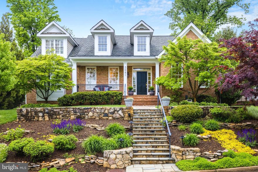 Elegantly sited atop a hill on a tree-lined cul-de-sac within the rolling hills of Bellevue Forest, this wonderful 5BA, 4FBA, 2HBA custom built home by Spring Street Development offers approximately 4,800 square feet of finished living space with 9ft+- ceilings on the main and lower level, multiple porches, including one that is screened, and an attached oversized 2 car garage with paver driveway. The bright & open floor plan is perfect for entertaining as well as for comfortable family living. With excellent proximity to a multitude of nature trails and within a mile of Washington Golf and Country Club, this Arlington gem is not to be missed.

Pristine and mature landscaping along with extensive tiered hardscaping and flagstone stairs make a gracious setting, leading to both a flat front and a private rear yard, maximizing the .25 acre lot. The front covered porch leads to a two story foyer that brings in plenty of natural light and opens to the graciously sized formal living room with a 12 foot tray ceiling and a lovely dining room. Curated wall and window treatments including plantation shutters throughout, coupled with fresh paint and updated lighting compliment the lovely hardwoods. The gourmet kitchen with granite counters and stainless appliances, large center island with bar seating and adjacent breakfast room with lovely views of the rear yard open up to both a wonderful screened porch and spacious family room with gas stone fireplace. The private main level library with gorgeous window views has French doors that lead to a private rear covered porch.  A mudroom, formal powder room and the oversized 2 car garage complete the main level.

The fabulous primary suite features a 10 ft tray ceiling, a sitting area, a private covered balcony for enjoying your morning coffee, and dual walk-in closets. The luxury bath features a dual sink vanity, a shower with dual heads, a separate soaking tub and two closets. The rest of the upper level includes 3 additional bedrooms, laundry room, and 2 full baths.

The fully finished walk-up basement includes a large rec room, powder room, 5th bedroom with an en-suite full bathroom, exercise/bonus room, plenty of closets and a storage room. All of this on a beautiful .25 acre lot with a lovely patio, fenced and private rear yard, mature trees, irrigation system, and plenty of room to play!