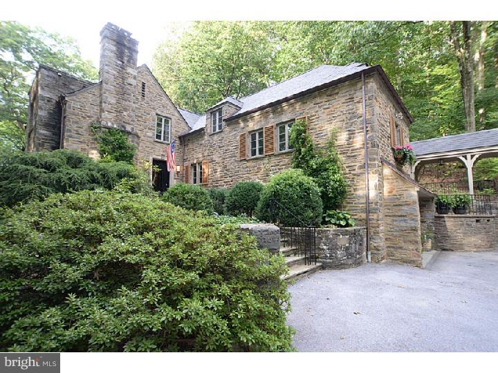 A once in a lifetime opportunity! For the second time in 76 years this historic home is on the market. Set on over 6 wooded acres with a level lawn surrounding the house and lovingly restored and added on to by current owners, Tanglewood combines the best of new and vintage. Enter into the two story foyer with original terrazzo floor, stunning curved staircase with stainless steel bannister, original light fixture and amazing mural. Just some of the updates include new Vermont slate roof, energy efficient windows, new oil tanks and well system, gourmet kitchen with Wolf 6 burner range, Viking Fridge, SubZero drawer freezers and Asko dishwasher (plus caterers kitchen downstairs with Dacor double oven and fridge), mud room with radiant heated floor, redone baths, convenient second floor laundry room, hardwood floors all refinished and added recessed lighting. Surrounding the main house you will find beautiful landscaping, a stone patio off the dining room and another stone patio off the heated greenhouse. A third stone patio abuts the garden shed that has electric and plumbing making a unique place for casual entertaining. Reached by a charming covered walkway is the Archer and Buchanan designed and built Carriage House. Just imagine the fabulous entertaining you could do here but it also serves a function as a quiet at home office and private space for guests. Architecturally compatible and constructed using some stone salvaged from original walls on the property, Carriage House contains a 30 x 23 Great Room with vaulted ceiling, floor to ceiling stone propane fireplace and reclaimed wide plank hardwood floors, Bosch dishwasher, Scotsman ice maker, two SubZero drawer refrigerators, two bar sinks, 13 x 14 guest room, large full bath with tiled shower and pedestal sink and loft reached by whimsical ladder. Outside the great room is a stone patio with stone wood burning fireplace and below is an oversized three car garage containing the mechanicals. Buried behind is the propane tank for the newly installed generator which will keep the whole property comfortable in all seasons, regardless of weather. The owners say it perfectly. They love being 5 minutes away from a quart of milk but feel miles away in wooded seclusion! Located in the best area just minutes from major highways, Wilson Farm Park, Chester Valley Trail and Trader Joe's and just down the road from Conestoga High School, TE Middle School and Hillside Elementary School.