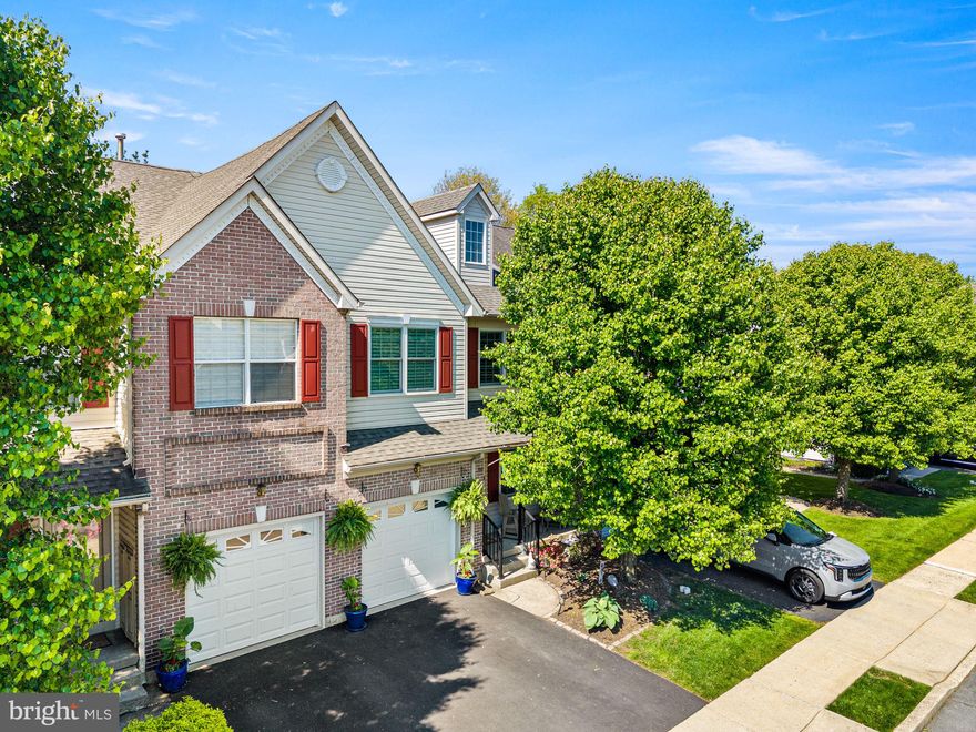 Welcome to 256 Larkspur Lane — a beautifully updated luxury townhome tucked away in Heather Meadows on a quiet cul-de-sac directly across from Heritage Park, featuring a scenic pond, walking trails, playground, and basketball courts. This move-in ready 3-bedroom, 2.5-bath home offers the perfect combination of luxury, comfort, and convenience. From the moment you enter, you’ll appreciate the hardwood floors, elegant moldings, and spacious open layout designed for both everyday living and entertaining. The gourmet eat-in kitchen features stainless steel appliances, a premium Viking gas range, tile backsplash, an oversized island, generous counter space, and a bright breakfast area. Sliding glass doors lead to the rear deck and paver patio overlooking peaceful scenic views. An additional refrigerator in the garage provides extra convenience and storage. The inviting family room offers additional living space filled with natural light. The finished basement provides flexibility for a media room, gym, office, or playroom along with extra storage. Second level offers a luxurious owner’s suite featuring vaulted ceilings, custom closet built-ins, and a beautifully remodeled spa-inspired bathroom completed in 2022. Additional highlights include hardwood flooring installed throughout the second level in 2023, an updated hall bathroom, renovated laundry room, and spacious secondary bedrooms. Located in one of the community’s most desirable settings, this meticulously maintained home offers low-maintenance luxury living in a highly convenient location. Do not miss your opportunity to make this exceptional home your own. Schedule your tour today!
