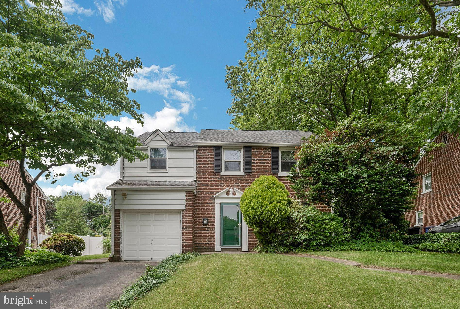 Welcome to this solid 4-bedroom, 1.5-bath brick Colonial, offering a classic layout, generous space, and significant potential for updates. Located in a highly convenient area close to shopping, parks, schools, and with easy access to Center City Philadelphia, this property is ideal for buyers seeking value and opportunity.
Inside, the main level features a spacious living room with hardwood floors that flows into a formal dining room—an ideal setting for both everyday meals and larger gatherings. The kitchen provides ample cabinet and counter space, and opens to a covered patio and deck area—perfect for outdoor dining or morning coffee. Adjacent to the kitchen, the breakfast room offers a bay window and exposed brick wall, creating a warm and functional space for casual dining. The fenced backyard is a standout feature—private, green, and ready for entertaining, gardening, or just relaxing. Upstairs, you’ll find four bedrooms and a full bath. The primary bedroom easily fits a king-size bed, while two of the additional bedrooms are nicely sized. The fourth bedroom is smaller, but well-suited for use as a nursery, office, or guest space. It’s currently functioning as a home office with great efficiency. The finished basement offers bonus living space, including a recreation or family room, a powder room, laundry area, and additional storage. Whether used as a playroom, gym, or media area, this level adds valuable flexibility to the home. The attached garage offers storage but is no longer full-size due to the expanded breakfast room—a practical update that enhances the home's main living area. Additional highlights include hardwood flooring throughout much of the home, classic brick construction, and a practical layout that supports everyday living. While the property is move-in ready, it offers a prime opportunity for renovation and customization to suit your style and needs. This is a wonderful home with good bones, a desirable location, and plenty of upside. Schedule your visit today and see the potential for yourself.