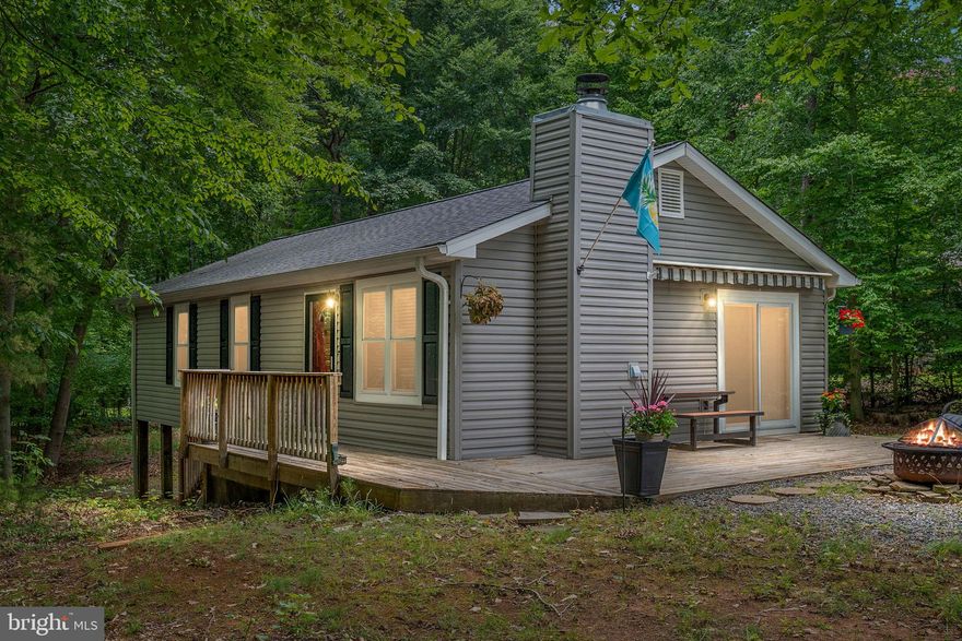 OFFER DEADLINE, WEDNESDAY, JULY 12, 2023 AT 7:00PM.  Peaceful and private home in the highly desirable Both Waters Estate at Lake Anna!  This 3 bedroom, 1 bathroom house boasts a gorgeously updated kitchen and bathroom, an oasis of a wooded lot just shy of 1 acre, and a driveway with 2 entrance points that wraps around one side of the home for easy boat hauling. The roof, siding, gutters, fireplace stone surround, and windows are just 7 years old. The HVAC and well pump are only 1 year old! Diagonally across the street, you have easy (gated) access to BOTH, the private (warm) and public (cold) sides of Lake Anna! Boat slip #17 on the public side conveys.