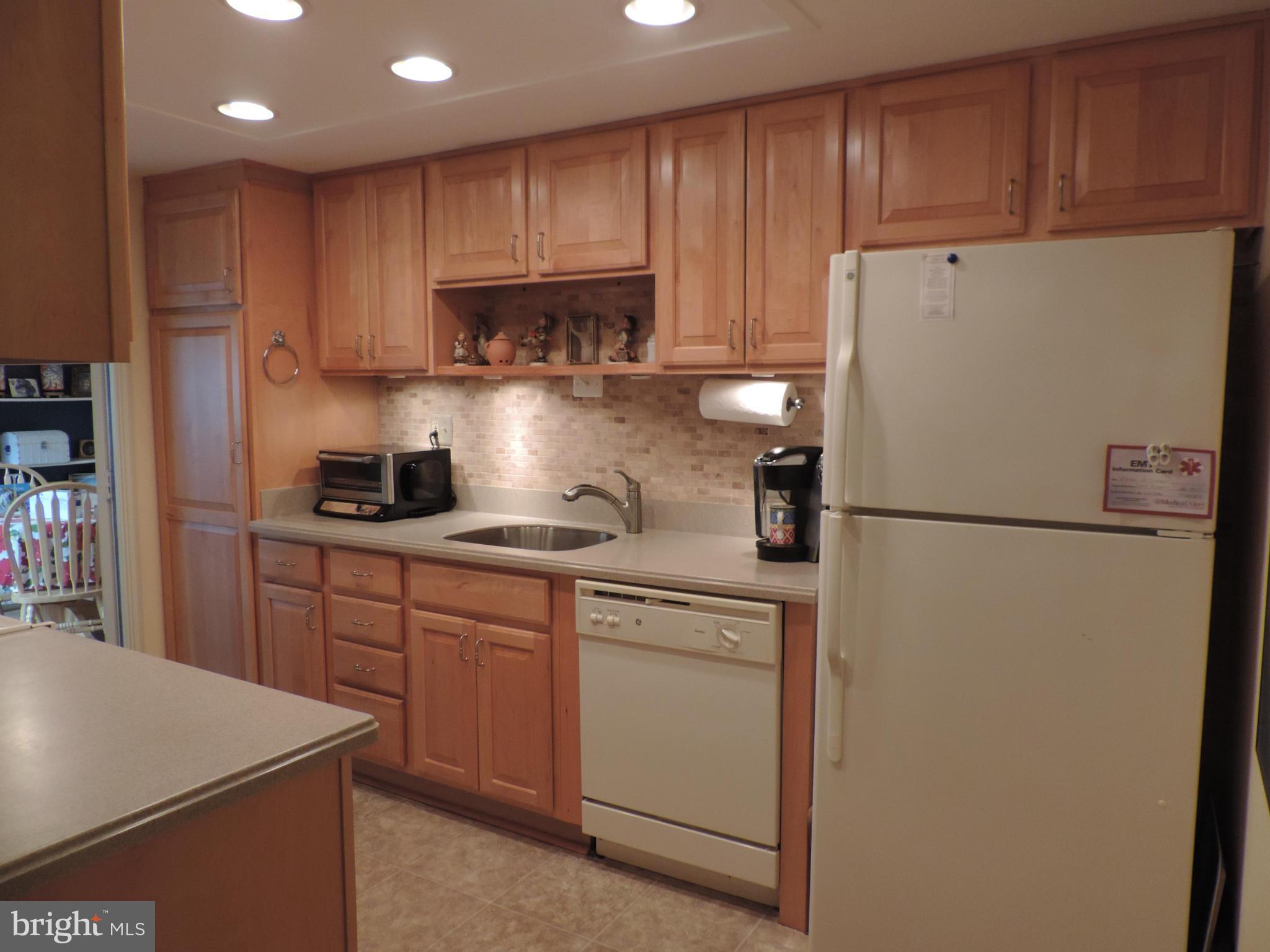 55+ Leisure World. Beautiful 1-level Patio Home with 3 bedrooms, 2 full baths, Updated Kitchen, Laminate floors. Wood burning fireplace. Bonus breakfast room with slider to Patio and large storage/pantry closet. 1 Car garage with plenty of additional storage. Please act quickly to secure this wonderful property.