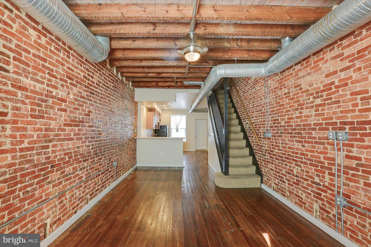 John Hopkins Employees..LIVE NEAR YOU WORK!!! Money available for 1st Time Home Buyers!! Lovely well maintained town home in McElderry Park. Two bedroom, 1.5 half bath with Exposed Brick Wall, stylish industrial interior with contemporary flare. Fenced in Back Yard and convenient to Patterson Park, markets, John Hopkins Hospital and other popular destination places and communities.