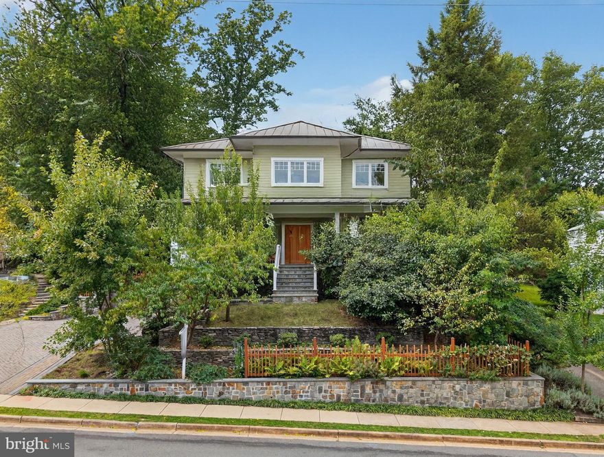 *Featured in “The Arlington Connection” and "Best Address" with Joe Himali!*

In the heart of Northern Virginia, where McLean, Arlington, and Falls Church meet, this extraordinary LEED Gold-certified custom home combines authentic Craftsman design with precision engineering to achieve unparalleled comfort, style, and energy efficiency.

Flooded with natural light from oversized windows,10ft ceilings on the main floor create expansive and inviting spaces, while warm wood accents, live edge built-ins, and artisanal stonework impart traditional Craftsman charm. The open-concept floorplan is perfect for relaxing or entertaining, allowing family, friends, and guests to enjoy the grand stone fireplace while creating gourmet meals in the thoughtfully designed kitchen, complete with custom maple cabinetry, soapstone countertops, and top-tier Energy Star and Bosch appliances. French doors open onto a secluded, organic landscape with a manicured lawn, elegant hardscaping, and an outdoor kitchen with a large countertop, built-in sink, and gas grill.

Every element of this home has been thoughtfully designed to optimize comfort and efficiency—from heated stone floors and custom window treatments, to high-quality built-ins and flexible closet configurations that maximize storage options. Upstairs, an expansive master suite enjoys a private, screened balcony and a stunning marble bathroom with separate shower, soaking tub, and wrap-around dual vanity. En suite bathrooms in three of the four other generously-sized bedrooms ensure that this home can grow with your family and offer plenty of options for guests. The fully-finished basement includes a 2-car drive-in garage, mudroom, workshop, and additional storage areas perfect for an exercise room and wine cellar.

A masterpiece of energy-efficient design, this LEED Gold-certified property boasts a two-zone, multi-stage geothermal heating and cooling system, on-demand European-style hot water heaters, and state-of-the-art sound-proofing and insulation technology to drive utility bills down to a bare minimum in the height of summer and dead of winter. With an energy-recovery ventilation (ERV) fresh air system, durable metal “solar-ready” roof, and rainwater catchment-fed landscaping irrigation, smart engineering seamlessly harnesses nature to maximize self-contained efficiency.

Located in the Fairfax County Public School District, this home feeds into Haycock Elementary School, Longfellow Middle School, and Mclean High School. Just over a mile from East Falls Church Metro and Rt. 66, it provides easy commuting options to both Washington, DC and bustling Tyson's Corner. 

Street power lines have been edited out of the listing photos to better display the home's facade.
