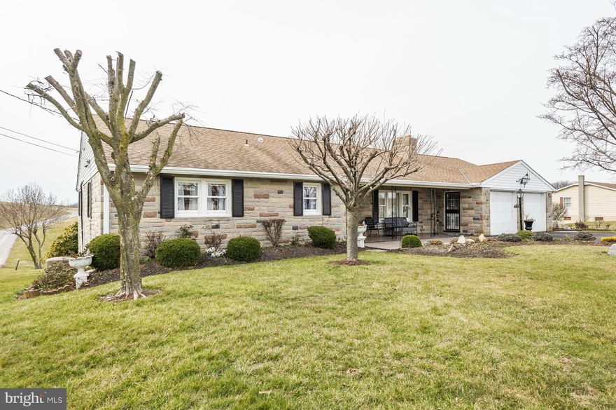 MOTIVATED SELLER: This stunning ranch is as good as new, but at a better price. Many updates/upgrades include: hardwoods throughout*stone masonry fireplace*recent windows and roof*mechanical systems*CAC*gutters*. Lovely private rear yard with great views*a level basement walkout and full apartment with wood stove hookup. Spacious rooms and economical hot water baseboard oil heat.