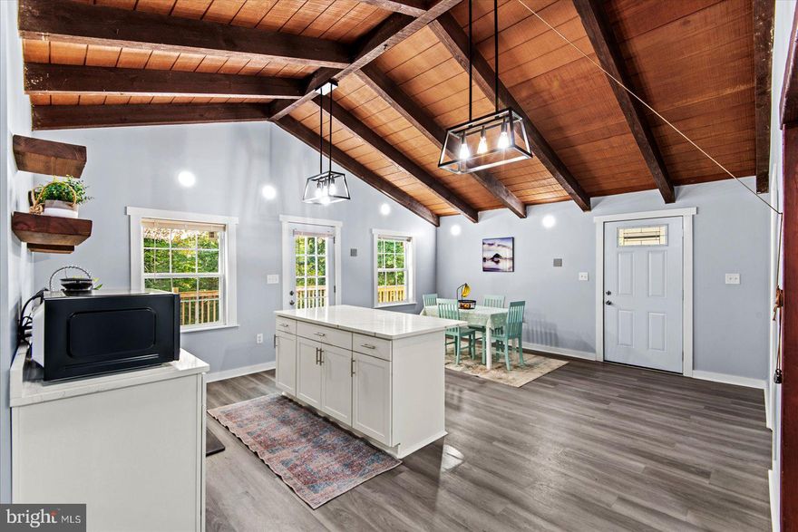 Welcome to 12248 Clementine Ln, a beautifully renovated 4-bedroom, 3½-bath home offering the perfect blend of modern updates, rustic charm, and everyday functionality. Set on almost 2 private acres, this property is ideal for anyone who wants space, privacy, and flexibility—without giving up convenience.
Step inside to find LVP flooring throughout, fresh paint, and a bright open-concept kitchen featuring quartz countertops, a large island, open shelving, and all-new stainless steel appliances. The vaulted wood-beam ceilings and painted brick fireplace bring a touch of warmth and character, while the updated bathrooms and new systems mean peace of mind for years to come.
You’ll love the four decks—perfect for relaxing, entertaining, or just enjoying the quiet natural surroundings. The partial basement offers laundry space and a multi-purpose room that can serve as a craft studio, home office, or play area.
Recent major updates include a new roof, HVAC, windows, electrical, and a new distribution box (installed Dec 2024)—so all the big work has been done for you. Outside, you’ll find four additional sheds and workshops, ideal for hobbies, storage, or small homestead uses such as gardening or keeping a few backyard chickens.
Whether you’re a growing family, downsizer seeking single-level living with extra space, or an investor looking for a strong rental or multi-use property, this home offers incredible value and versatility. Enjoy the peace of country living while staying close to King George amenities and major routes for an easy commute.
Turnkey, spacious, and full of character—this one is ready to welcome you home!