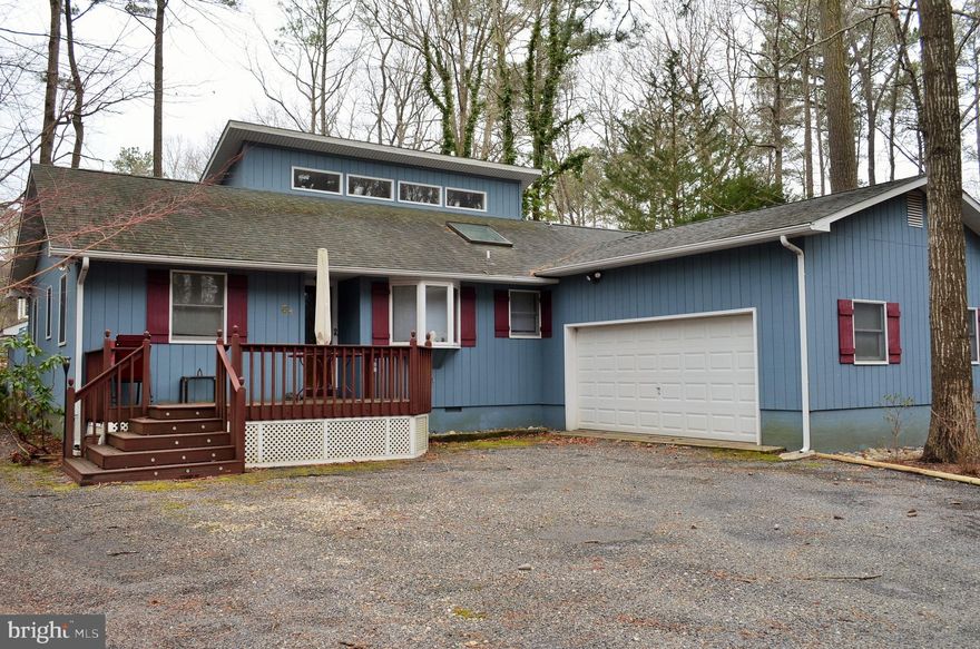 One level home close to the Community center in Ocean Pines, MD. Large eat in kitchen with beautiful solid oak cabinets.   Side by side refrigerator with in door water and ice dispenser. Hardwood floors in open living and dining room plus vaulted ceiling with 4 stationary transom windows allowing natural light into the home. Huge sun room off living room with a natural gas fireplace.  Carpet in bedrooms. Full size washer and dryer in laundry just inside the house from the garage.  Master bath has two sinks, full tub and make up counter for the lady of the house.  Bedroom has sliding glass door leading to private deck.  The room used as a third bedroom does not have a closet.  Huge driveway for 4 plus vehicles.  Being sold unfurnished.  Ready for you to decorate.  Price reduced...come take a look at this beautiful home.  Lots of space inside plus a large back yard for cookouts and fun for all.