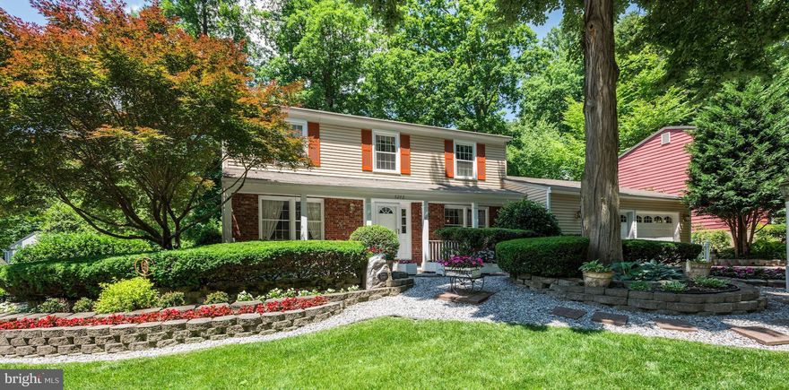 Gorgeous landscaping front and back - corner lot.  ML features foyer entry, Living Room, Sep. Formal Dining Room, country kitchen with breakfast area overlooking Family Room w/FP and exit to rear patio.  UL features 4BR converted to 3BR (incl. MBR w/ensuite bath and hall full bath). LL features newly carpeted Recreation Room with walk up exit. Replacement windows. SOLD AS IS.