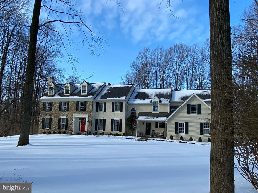 Come home to this remarkable estate home on a tranquil 2+ acre lot surrounded by trees in the development of Whitehorse. Open the front door to a large open foyer leading to beautiful floor to ceiling windows letting in lots of light and airiness and surrounded by custom crafted woodworking everywhere you look! The formal living room to your left of the entrance looks directly onto a lovely gas fireplace and is spacious and open for entertaining, and to the right of the entrance is a formal dining room for family dinners and special dinner parties with friends. Just a short distance to a beautiful gourmet kitchen with top of the line stainless appliances, including a six burner Wolf range/oven that any cook would be delighted with, a Subzero refrigerator, additional Wolf wall oven,  Dacor microwave, beautiful custom tile work and granite countertops, again spacious windows bringing in lots of light, and a island perfect for casual gathering, leisurely working on your laptop, or watching the chef at work creating delicious meals. The breakfast area looks out onto a spacious deck that faces the backyard and tree line, also perfect for outside entertaining, and then  flows right into a bright and airy yet cozy family room, surrounded by wall windows, built in cabinetry for your TV, books and other treasures to display, along with another wood burning fireplace that you can cozy up to on cold and wintry nights.  Continuing on, you will find a beautifully decorated powder room tucked away and next to a private home office. Moving up the beautiful staircase leads you to a large sitting room for quiet alone time and then leading into a spacious Master Suite with tray ceiling and overhead lighting, two walk-in closets with built ins, and leading to the Master Bath with a jetted tile tub, tile shower, plantation shutters, and his and hers vanities. Down the hall leads you to four additional bedrooms and two full baths, the one room being an expansive area perfect for multiple uses, possible playroom, workout center, or another family get together room. The lower level of this home has a full kitchen with beautiful cherry cabinetry, a media room/ family room, completely furnished, 3 additional rooms to be used for whatever your needs may be, and another full bathroom. This area is PERFECT for an in-law suite,  guest suite, or possibly for grown children that need their own space and privacy. There is also a storage area with plenty of shelves to store things and also where all the mechanical systems are located. 
This is a great home to raise your family, with great schools, or share your home with other loved ones, and despite the fact you’re enjoying private country living, you are still convenient to great shopping areas, restaurants, and majors roads, ten minutes to the Paoli train station, and just under 40 minutes to the Philadelphia airport. 
 Make an appointment to visit this lovely traditional and bright and airy home and make it yours! You will absolutely love living in this beautiful community!