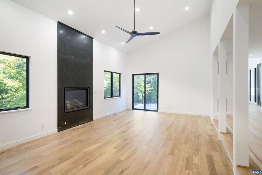 This property has undergone flawless upgrades, elevating a well-built architectural gem to a supreme level of style, comfort, and quality. Offering 5 bedrooms and soaring interior spaces, the home features two first-level primary suites, including a private guest suite. The second level includes three additional bedrooms and two baths (one en-suite), along with multiple flexible spaces ideal for creative pursuits, offices, or studios. Designed for seamless indoor-outdoor living, enjoy coffee, cocktails, or dining on four porches, including a large covered wraparound porch. The stunning new kitchen showcases premium custom cabinetry and Viking appliances, flowing effortlessly into the open great room, cozy family room, wet bar, and outdoor entertaining areas. The great room?s striking fireplace anchors the space, complemented by a second fireplace in the inviting family room. The primary suite, great room, and family room all open directly to the covered porch. A separate yet connected guest primary suite linked via a glass walkway offers exceptional privacy and includes a second-floor office or workout space. Located on 11+ acres off Garth Road surrounded by conservation land, gives it rare privacy and blue ridge view opportunity.,Quartz Counter,Wood Cabinets,Fireplace in Great Room,Fireplace in Study/Library