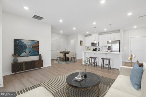 Photo of 12850 Mosaic Park Way #2-W, HERNDON, VA 20171 (MLS # VAFX2337584)