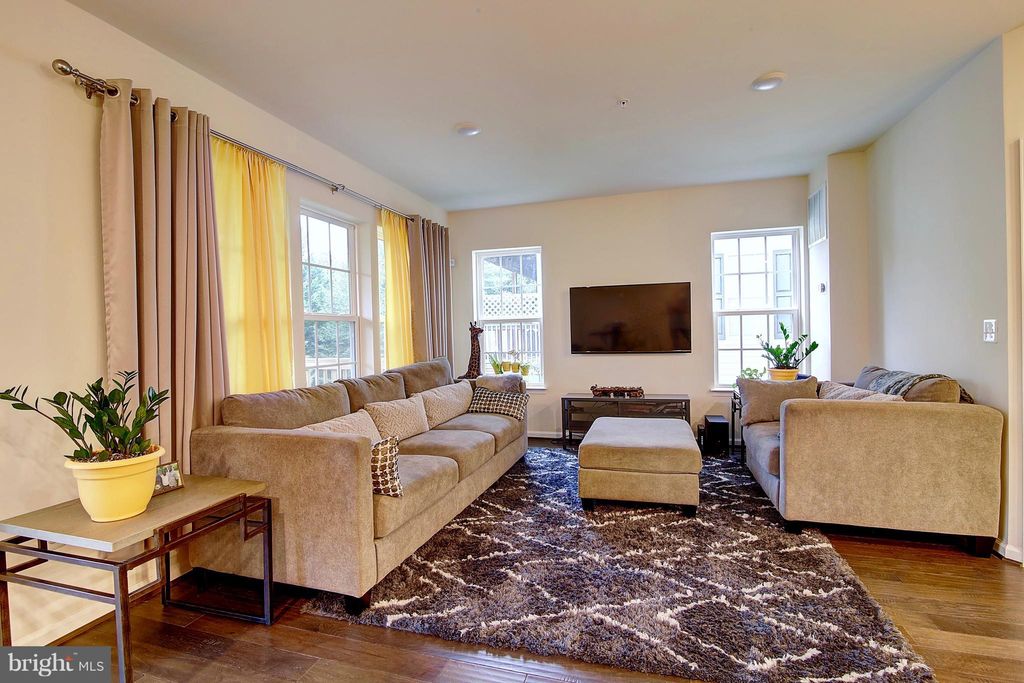 Photo of 13937 Hollow Wind Way #101, WOODBRIDGE, VA 22191 (MLS # VAPW2121960)