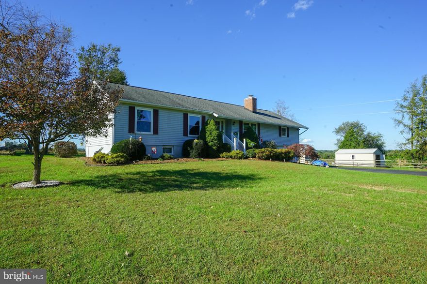 Make this your home in December!  Wonderfully maintained rambler sited beautifully on gorgeous 3.32 acre lot! Breath taking views in all directions!  Huge Great Room!  Large two level 2 car garage with lots of storage space!  Two driveways make it perfect for additional garage and work shop, or RV!  Many recent improvements include new windows!  Rare opportunity for over 3 acres!