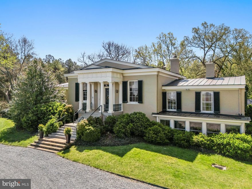 Introducing Ashleigh, a storied 98-acre estate with sweeping views of the Delaplane countryside. Originally part of Chief Justice John Marshall’s Oak Hill holdings, this Greek Revival manor was built for his granddaughter and remains one of Virginia’s most admired historic properties. Ashleigh is listed on both the National Register of Historic Places and the Virginia Landmarks Register, and is further protected by a conservation easement with The Land Trust of Virginia.

The main residence showcases grand proportions, 12’ ceilings, heart pine floors, triple-sash windows, and elegant entertaining spaces including a double drawing room, formal dining room, paneled study, and a sun-filled gallery entry. The east wing features an extraordinary octagonal library added in 2001, while the west wing hosts a private and refined owner’s suite.

The grounds are truly exceptional—renowned gardens with three outdoor garden rooms, curated plantings, wisteria-draped pergola, massive boxwoods, sculptures, a 100’ fountain, heated pool, and a pool/guest house with full kitchen and two bedrooms. Additional structures include three stables (17 stalls combined), run-in sheds, machine shed, farm manager apartments, and a charming 2-bedroom guest cottage near the main house.

Perfectly positioned at the intersection of Route 17 and Route 55, with quick access to I-66, Ashleigh offers unmatched beauty, privacy, and historic pedigree—an extraordinary Delaplane opportunity rarely available.