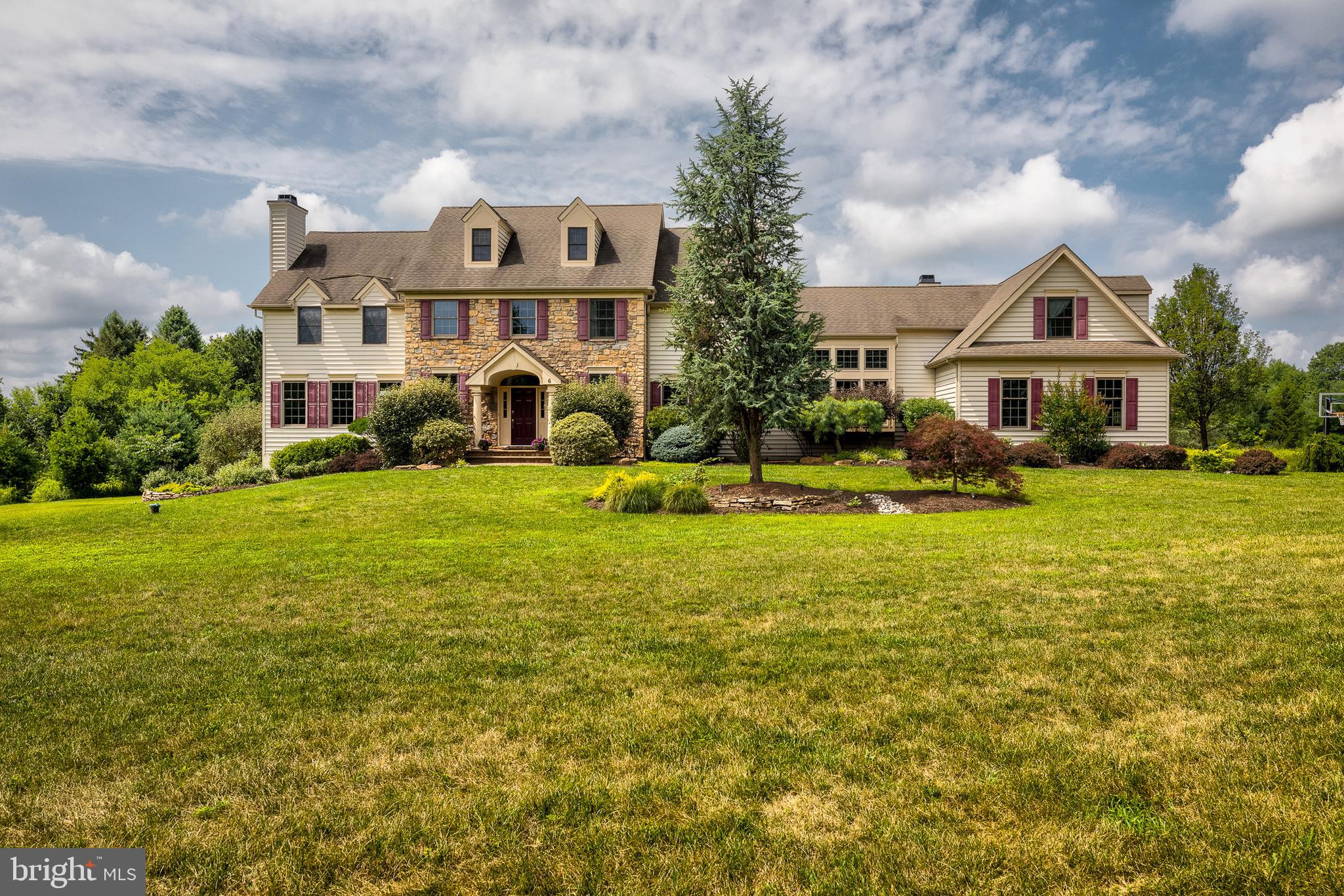 Welcome home to 6 Buckman Drive where Elegance and Charm Greet you when you step inside, this custom built home. Situated on over 6 acres, you are completly surrounded by Nature with scenic and panaramic view, gives you the true feel of mother nature, right here in Wrightstown Twp. The street and home gives you the feeling of calm, and is minutes away from the center of Newtown. You will see Gorgeous crown moldings, wainscoting and beautiful custom built ins, throughtout the downstairs. The Grand foyer leads to a beautiful sitting room, with a Gas fireplace and a private balcony, with a view of your amazing property. You have your formal dining room with large windows and easy access to your grand eat-in kitchen .You can enjoy your home cooked meals in your spacious open kitchen with cherry cabinets, granite counter tops and stainless steel applicances. The kitchen also boosts an oversized island with extra seating and cabinet space. The Natural Light brightens up the entire house. The family room has access to the large Trex deck and beautiful stone fireplace, perfect for family movie night.Upstairs Your main bedroom has a beautiful tray celling, a sitting room with a bay window where you can sit and watch the sunset and more closets than you can dream of. Your Main bath comes with a soaking tub and more closet space.2 more bedrooms greet you, each with their own full bathrooms.Down the hall you have access to the second staircase, whihc leads you to two more bedrooms and another Full bathroom, perfect for guests, au pairs or an in-law suite.Finished Walk out basement gives access to the Amazing backyard and pool, it is the perfect space for entertaining. Minutes away from all major Routes, I95, Route 1, and the Turnpike.