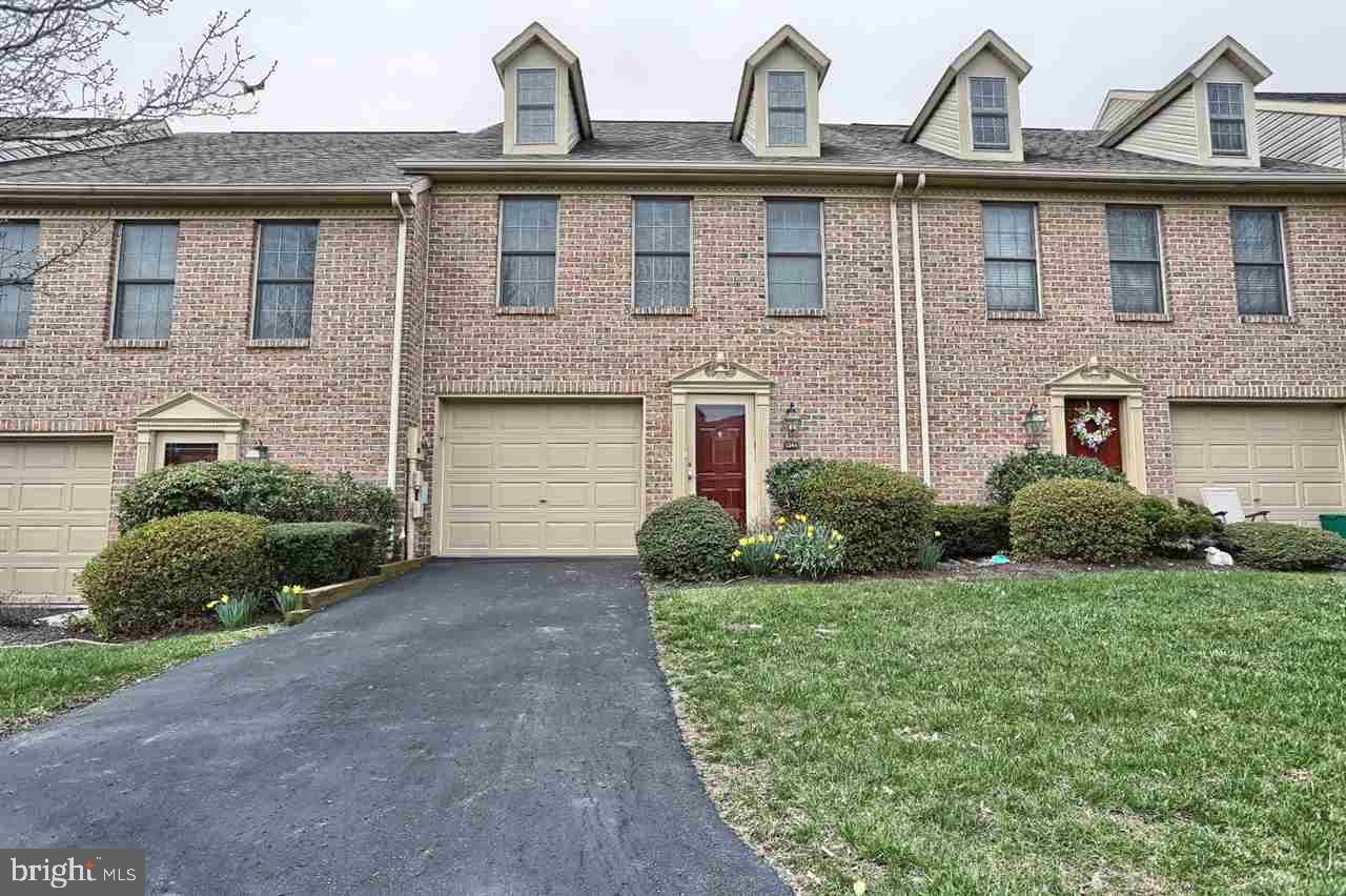 Lovingly preserved brick front townhome w/ample dimensions throughout. High grade, richly colored laminate floors through main level provide versatility for wear & tear & stay beautiful w/a high shine. Plenty of cabinets & counter space complete w/breakfast bar for quick meals & formal dining room for sit-down dinners. Open foyer with contemporary colors catch your eye. Ample master bedroom features updated full bath & spacious walk-in closet that you don't see coming. Huge 2nd bedroom just got new carpet!