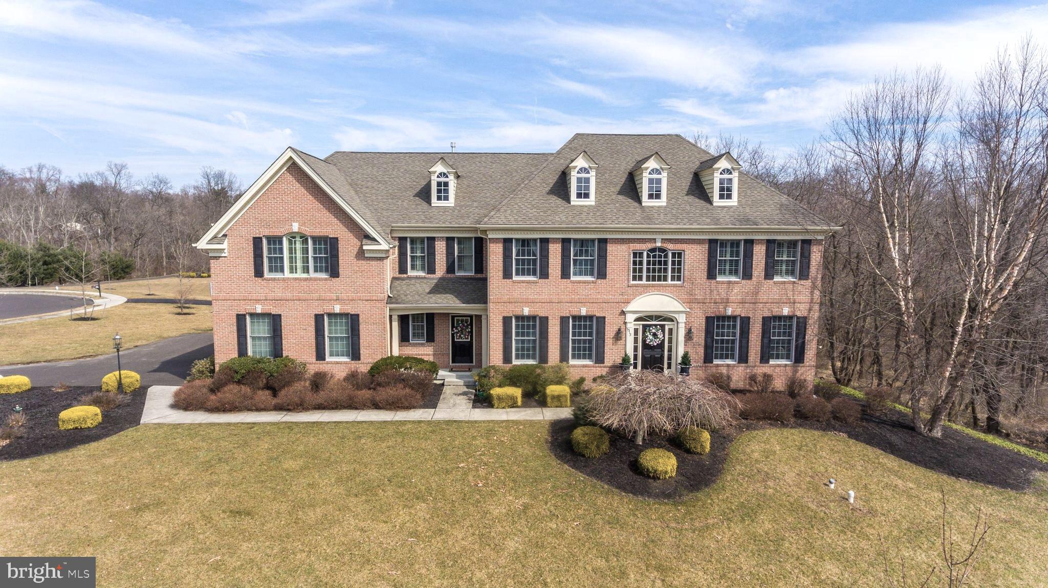 Welcome To the "Preserves at Chanticleer Upscale and sought after location within the Washington Crossing zip code of 18977. This 5-bedroom, 4.5 bath, Bellingham Model has been extraordinarily upgraded with the highest standard of craftsmanship. Well-appointed amenities throughout, sophisticated crown molding, wainscoting and millwork grace every room. As you enter, you re embraced by a stately 2-story foyer with grand staircase and chandelier as the centerpiece. Flanking the foyer are the formal living and dining rooms reflecting elegance and style. The open floor plan features gleaming hardwood floors, lots of window views and natural light throughout. Beyond the staircase is the center of the home boasting an expansive Great Room with open seating, gas fireplace and chandelier lighting. A view of the Gourmet Kitchen is a entertainers delight. All steel professional Kitchen Aid appliances including burner/grill cooktop and range hood, Architect Series 48 built-in refrigerator, double-wall oven, microwave, dishwasher, undercounter ice maker and wine cooler. All kitchen counters and island are covered in opulent granite. Cabinetry in rich cherry woods plus a Butlers pantry. The Grand Morning Room enhances a designer kitchen layout with elevated breakfast bar, cathedral ceiling and gorgeous Palladium window views overlooking the property. The first floor has a large office with French doors, powder room, an additional storage pantry plus mudroom with outside access. Wrought Iron spindles augment a grand staircase leading to an open 2nd floor landing. The luxurious master bedroom ensuite has a stunning coffered ceiling, and lounge seating area with gas fireplace. California closet is a room of it s own. The master bath tiled in all natural travertine stone, features a multi-spray shower and soaking tub that creates a private spa experience. 4 more spacious bedrooms with 2 more full bathrooms plus laundry facilities with plenty of closet and storage space. Beautiful finished daylight walk-out basement with bar/lounge and full bath add an additional 1800 sq. ft. of living space. Workout and storage area complete this level. Excellent location, shopping, fine dining and cultural events. Blue ribbon schools. Easy access to all major routes, 90 min. to NYC. Love where you live. Beautiful Bucks County.