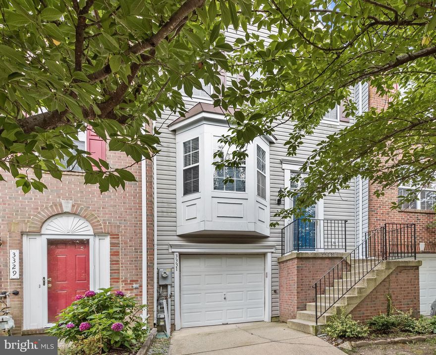 Beautiful Colonial garage townhome located in Ellicott City’s Howards Ridge community.  This home has been recently updated with recessed lighting throughout and LVP flooring on the entire upper level.  The main level highlights gleaming hardwood flooring, and a neutral color palette with accent architectural columns.  A bay window allows abundant natural light in the chef’s kitchen that includes a breakfast nook, granite countertops, and stainless appliances that include a built-in microwave, a gas stove, and French door refrigerator with an icemaker and water dispenser.  A gas fireplace in an elegant cream stone setting creates the focal point of the open floor plan that includes living and dining areas with sliding door access to the trex deck.  Ascend the staircase to the bedroom level finished with LVP flooring throughout and the primary suite has a walk-in closet and attached bath with a glass enclosed shower and soaking tub with decorative tile inlay, and an extended vanity.  Two additional bedrooms and a second full bath complete this level.  The lower level has a powder room, storage space, and a walkout family room.  Enjoy outdoor living on the expansive deck and shaded patio in the privacy fenced backyard. PLENTY OF GUEST PARKING SPACES IN FRONT OF HOUSE !!