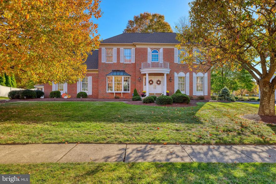 This elegant Haverford Federal home boasts numerous upgrades and additions, blending style and functionality in the highly sought-after Cold Spring Hunt community, within the award-winning Central Bucks Blue Ribbon School District. Featuring a brick façade and a two-car side-entry garage, the home welcomes you with a widened driveway leading to a professionally landscaped walkway, a stately portico, and double Therma-Tru entrance doors. The two-story foyer impresses with solid oak hardwood flooring, custom chair and crown moldings, and a stunning chandelier equipped with a motorized Aladdin lift. A turned staircase with refinished handrails and carpeting leads to the upper level. Adjacent to the foyer, the formal living room features a bay window, crown and dental moldings, and double French doors opening to the family room. The dining room includes hardwood flooring, another bay window, and elegant moldings for a sophisticated touch. The gourmet kitchen, renovated by Signature Kitchens, showcases Brookhaven cabinetry in nutmeg maple with undermount lighting, “Ivory Fantasy” granite countertops, a Kohler porcelain sink, and a Durango Travertine backsplash. Stainless steel appliances include a Thermador 5-burner gas cooktop with a custom vented hood, Wolf double ovens, a Bosch dishwasher, a GE Space Saver microwave, and a Sub-Zero side-by-side refrigerator. The spacious island, perfect for casual seating, is complemented by beadboard and Murano stained glass pendant lighting. The adjoining breakfast area, with a vaulted ceiling, skylight, and garden bump-out, opens to an expansive EP Henry paver patio and a private fenced yard backing to woods. The family room features newly installed red oak flooring, a wood-burning fireplace with a brick surround, and recessed lighting. Additional living space includes a custom Home Entertainment/Audio Room with a tray ceiling, gas fireplace, granite-topped wet bar, and atrium doors leading to the patio. Completing the main level are a private office (or potential fifth bedroom), a laundry room, and a half bathroom, also renovated by Signature Kitchens. Upstairs, the luxurious owner’s suite includes double doors, a walk-in closet, three additional closets, and a private office or nursery with a vaulted ceiling. The remodeled en suite bathroom offers a Hydro-System whirlpool tub, a walk-in shower with massage jets, dual quartz vanities, and a linen closet. Three additional bedrooms, each with recessed lighting and double closets, share a well-appointed hall bathroom. The finished basement is a haven for recreation, featuring a game room with a high-end Gandy slate pool table, a living area, an exercise room, and an unfinished workshop for storage. A door leads to a 4-foot-high storage area beneath the Home Entertainment Room. Additional amenities include a newer roof and gutters, a newer hot water heater, three-zone HVAC systems, and an expanded driveway for extra parking. This home is conveniently located near Cold Spring Elementary, Hansel Park, Bush and Holicong Parks, and the historic charm of Doylestown Borough with its museums, theaters, shopping, and dining. Easy access to major commuting routes and the Doylestown SEPTA station makes this property both unique and ideal.