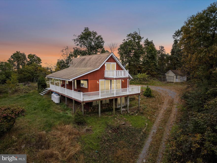 Let your imagination soar! This 2 bed/2 bath chalet home on 4.2 acres in Glenwood Forest is set on a flat yard on the ridge between the Shenandoah Valley and Back Creek Valley–both sunrises and sunsets are spectacular! The home could use some attention to finishing details, but this kind of location is really special and a rare find. Outside, the expansive wrap-around decks provide the ideal setting for enjoying your morning coffee or hosting evening gatherings while soaking in the spectacular views. With plenty of outdoor space, you can easily create your own oasis—whether it's a garden, a play area, or a tranquil spot for relaxation. The open concept main living area is connected to the scenic setting with expansive windows and a cozy wood-burning fireplace. The upstairs level offers two bedrooms with Juliette balconies. The ground level offers another full bath, rec room, laundry room, and two flexible bonus rooms. The driveway has been recently re-graveled. This property offers the perfect balance of privacy and accessibility, making it a wonderful escape from the hustle and bustle, yet conveniently located near local amenities. Don’t miss this rare opportunity to own a slice of paradise in the heart of nature!