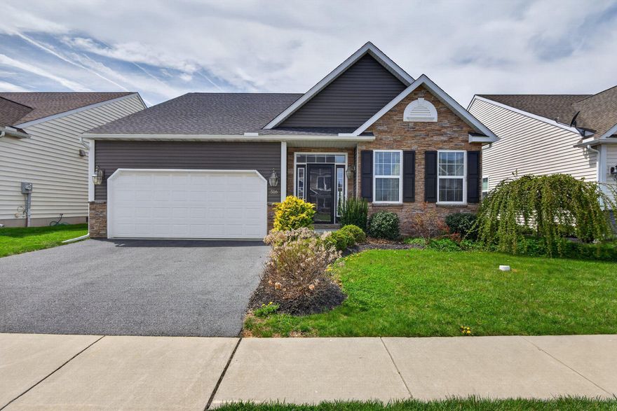 Here's the elevated listing description:

---

Welcome to 516 Jared Way — where like-new quality meets timeless charm in the heart of New Holland. Built in 2019 and meticulously maintained, this stunning 3-bedroom, 2-bathroom ranch home looks and feels better than the day it was constructed. From the moment you pull into the driveway, the eye-catching combination of stone facade, dark board siding, and lush, mature landscaping sets the tone for everything you'll find inside.

Step through the foyer and instantly feel the ease of single-floor living at its finest. Just off the entrance, a versatile front bedroom with a generous closet and beautiful views of the front yard makes a perfect home office, den, or guest suite. The home then opens up into a showstopping chef's kitchen that will leave you breathless — rich espresso cabinetry with crown molding, gleaming granite countertops, a full tile backsplash, and a suite of stainless steel appliances including a gas range, dishwasher, refrigerator, and a coveted in-drawer microwave tucked into the expansive island. The oversized island with pendant lighting is ideal for casual dining, entertaining, or morning coffee, and the kitchen flows seamlessly into the open-concept living and dining spaces beyond.

The elegant dining area, crowned by a chandelier and a sophisticated tray ceiling, transitions effortlessly into the spacious family room where a soaring vaulted ceiling, ceiling fan, and cozy gas fireplace create the perfect gathering space for every season. A sliding glass door invites you out to the maintenance-free composite deck with white vinyl railings — your personal retreat overlooking the sweeping, picturesque Lancaster County farmland that stretches out as far as the eye can see. Whether you're sipping your morning coffee or hosting a summer cookout, this view never gets old.

The primary suite is a true sanctuary, featuring a vaulted ceiling, ceiling fan, plantation shutters, and a generous walk-in closet with built-in shelving. The spa-inspired en-suite bathroom impresses with a double vanity, rich cabinetry, quartz countertops, and a stunning custom walk-in tile shower complete with a built-in bench seat, niche, and frameless glass enclosure. A third bedroom with a large closet and a beautifully appointed full hallway bath with tub/shower round out the living quarters.

Practical luxury continues in the dedicated laundry room, which features a front-loading washer and dryer on pedestals and overhead storage — with direct access to the attached two-car garage. And for those who want even more space, the massive unfinished full basement offers a blank canvas of incredible potential — think home theater, gym, game room, or in-law suite — with steel beam construction, high ceilings, and a roughed-in egress window already in place.

One of the most valuable upgrades this home offers is the whole-home Generac standby generator — a premium addition that gives you total peace of mind regardless of what the weather brings. You'll never be without power.

Luxury vinyl plank flooring flows throughout, plantation shutters add timeless elegance to the windows, and thoughtful details at every turn make this home truly move-in ready. Nestled in a vibrant New Holland neighborhood with beautiful curb appeal and breathtaking open farmland views from the backyard, this is the one you've been waiting for.

Come discover the charm, quality, and lifestyle that 516 Jared Way has to offer — your next chapter starts here.